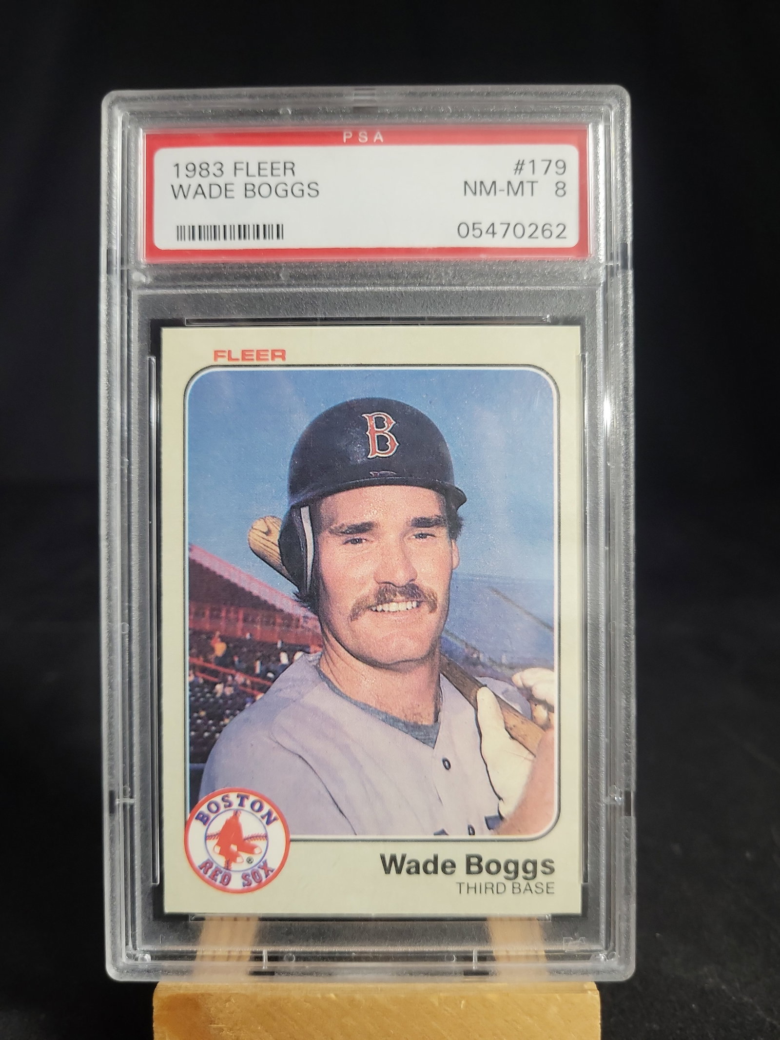 I04127 | 1983 Fleer Wade Boggs PSA 8: IMPORTANT â€“ PLEASE REVIEW BEFORE BIDDING: Aeron House makes every effort to accurately identify and describe each lot; however, titles and descriptions may contain errors, omissions, or AI-a
