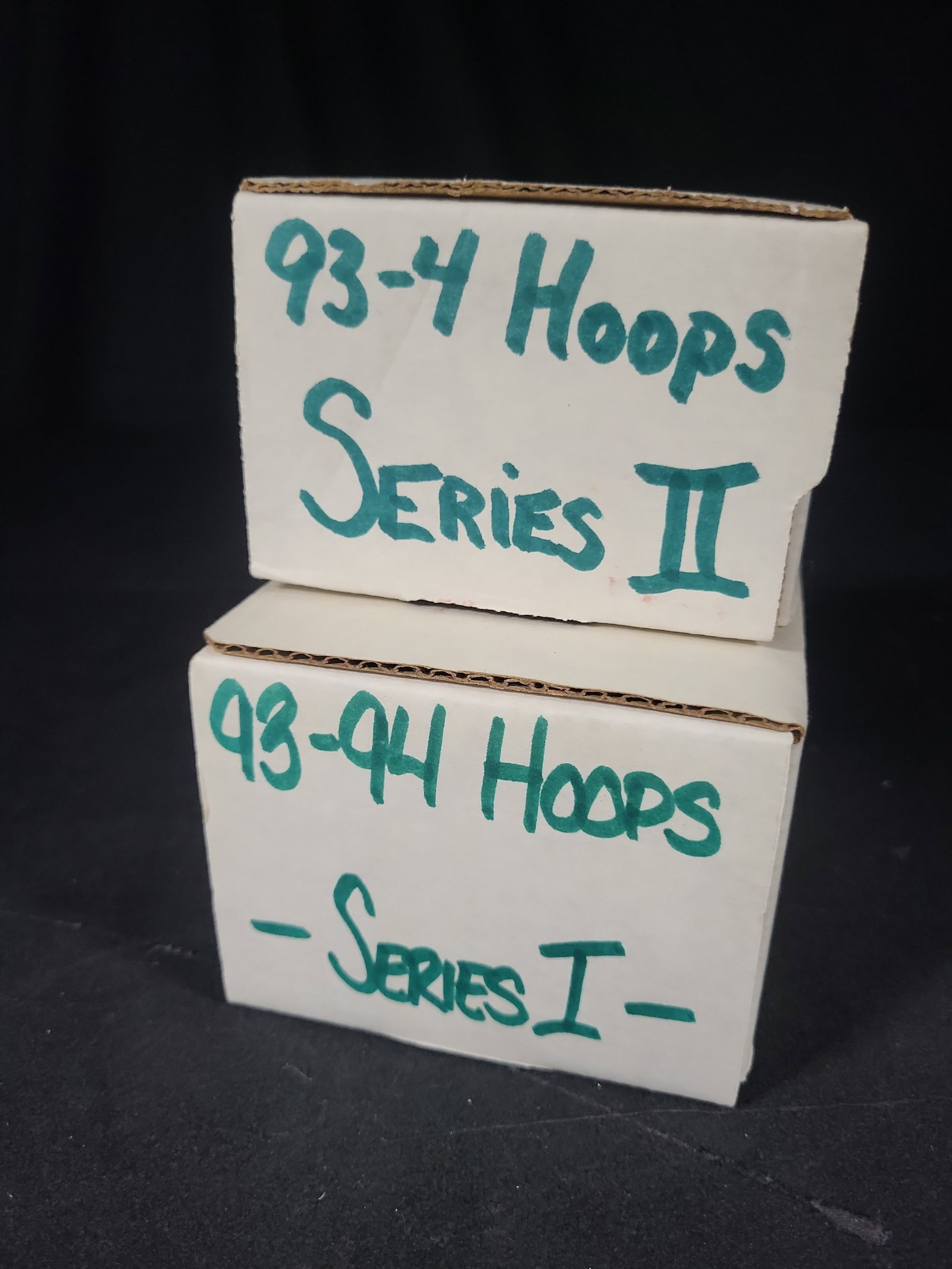 I03809 | A Collection of 1993-94 NBA Hoops Series I and Series II Basketball Trading Cards: IMPORTANT â€“ PLEASE REVIEW BEFORE BIDDING: Aeron House makes every effort to accurately identify and describe each lot; however, titles and descriptions may contain errors, omissions, or AI-a