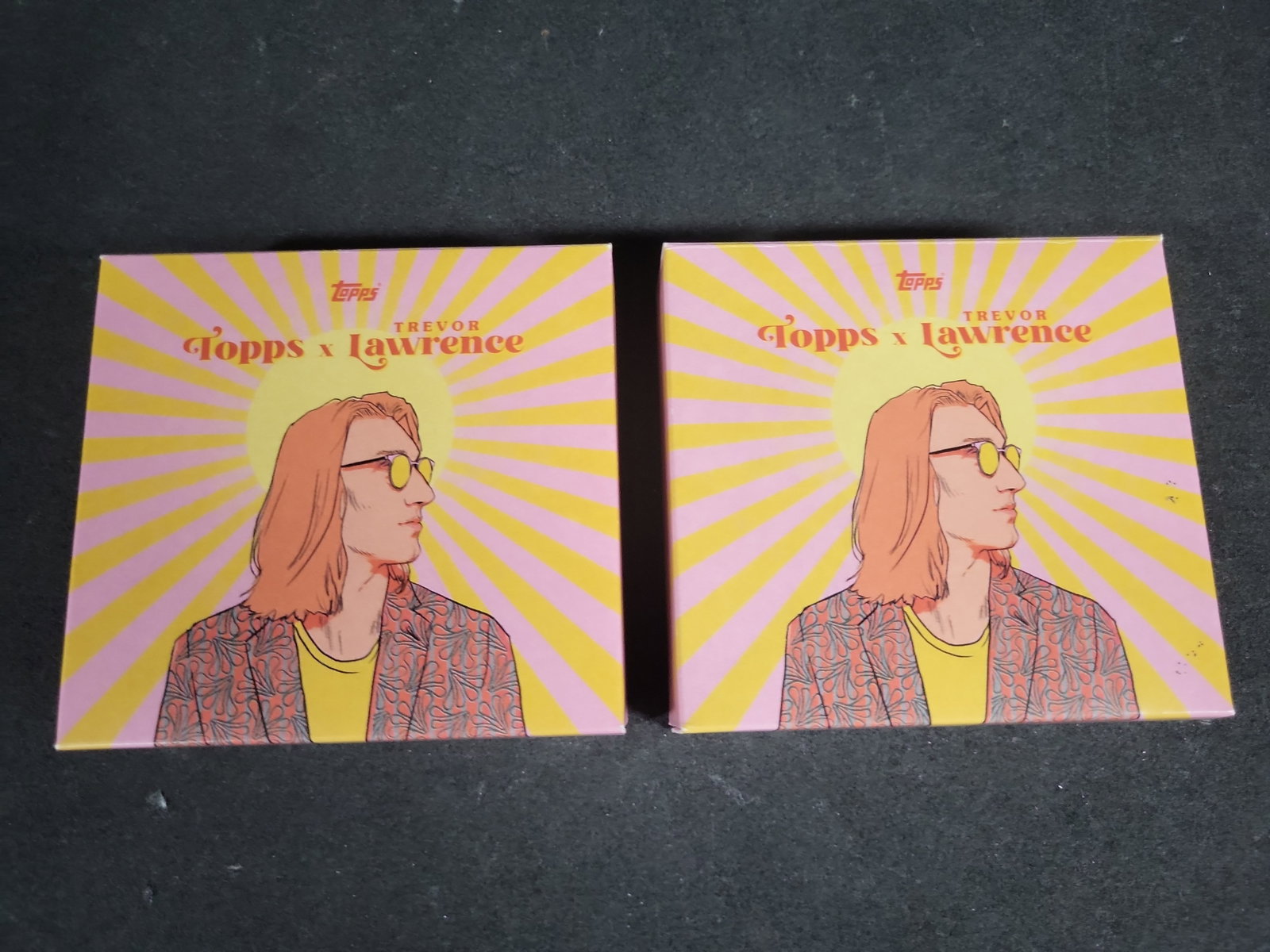 I04366 | 2021 Topps Trevor Lawrence Card Sets: IMPORTANT â€“ PLEASE REVIEW BEFORE BIDDING: Aeron House makes every effort to accurately identify and describe each lot; however, titles and descriptions may contain errors, omissions, or AI-a