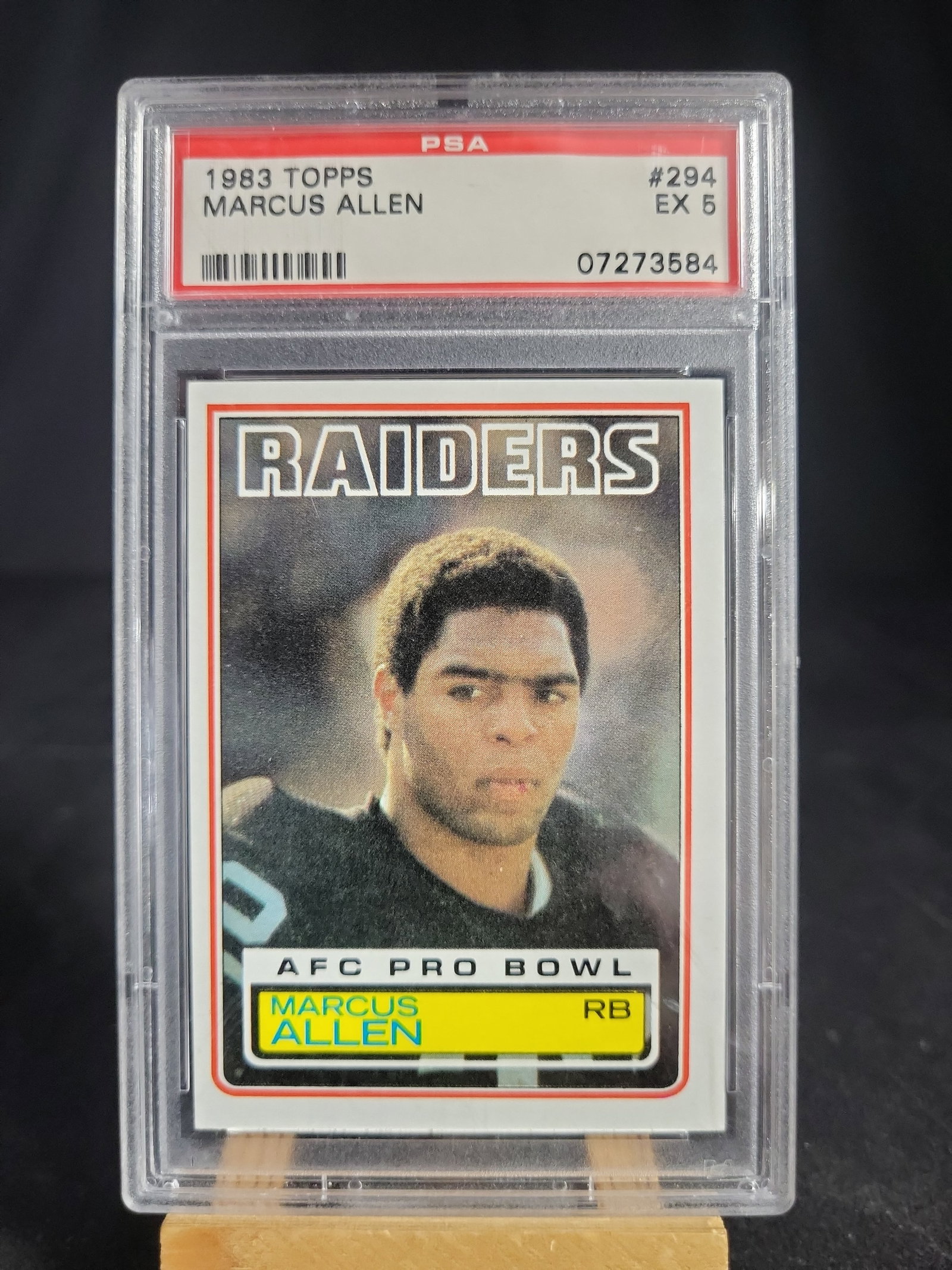I04126 | 1983 Topps Marcus Allen Card PSA 5: IMPORTANT â€“ PLEASE REVIEW BEFORE BIDDING: Aeron House makes every effort to accurately identify and describe each lot; however, titles and descriptions may contain errors, omissions, or AI-a