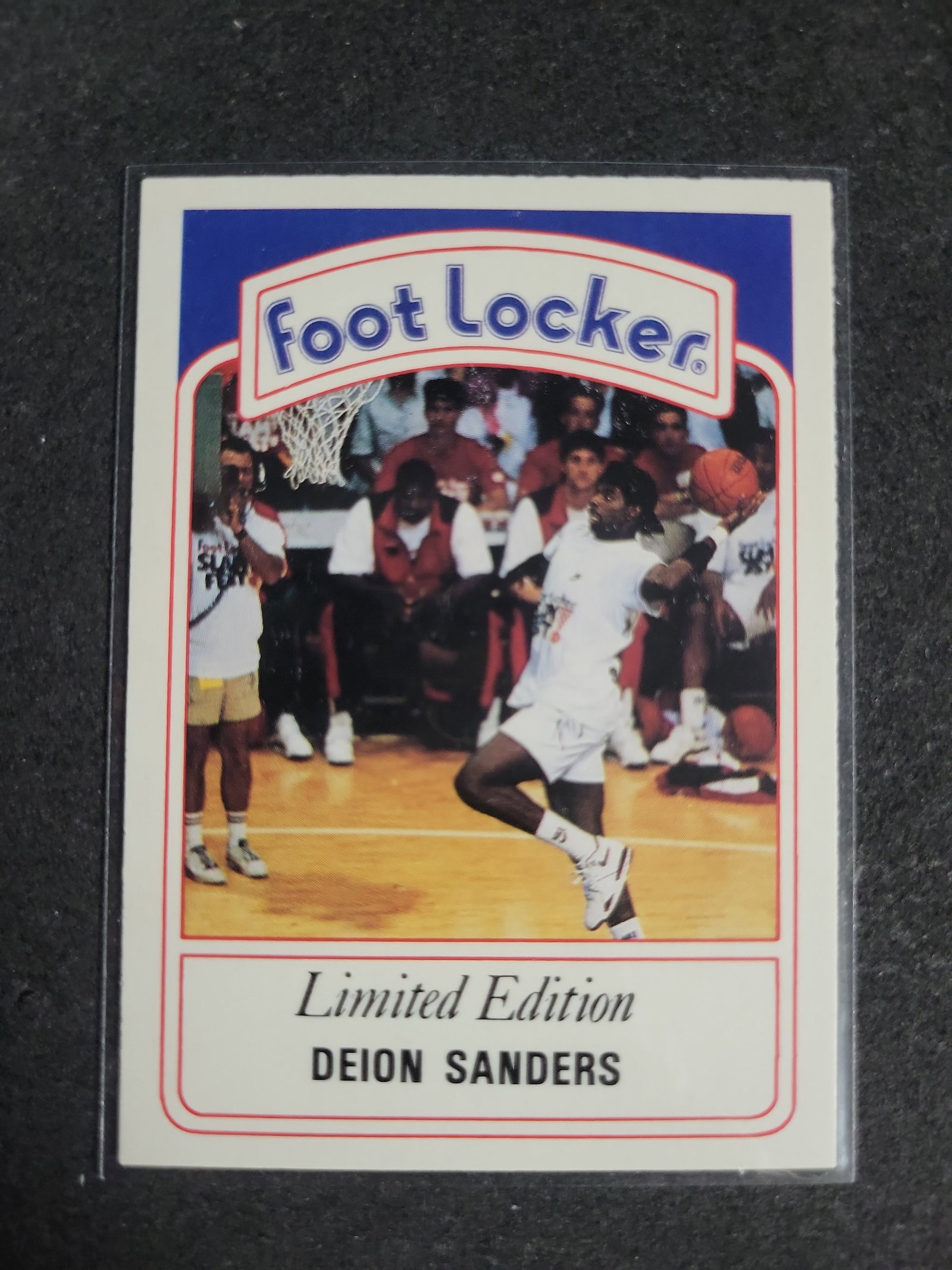 I04277 | 1991 Deion Sanders Foot Locker Card: IMPORTANT â€“ PLEASE REVIEW BEFORE BIDDING: Aeron House makes every effort to accurately identify and describe each lot; however, titles and descriptions may contain errors, omissions, or AI-a