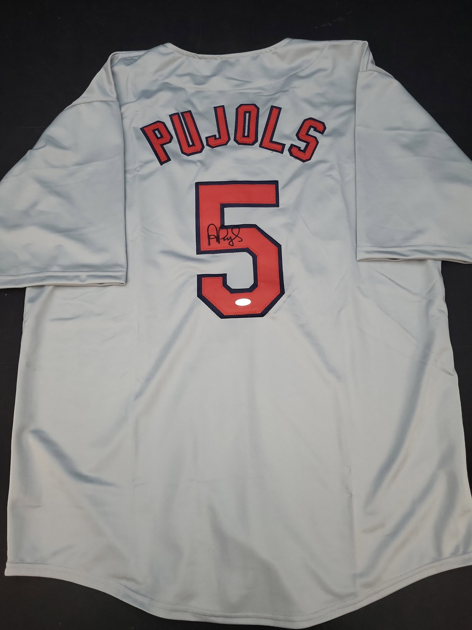 I03851 | Albert Pujols Signed St. Louis Cardinals Road Style Jersey with Steiner Sports: IMPORTANT â€“ PLEASE REVIEW BEFORE BIDDING: Aeron House makes every effort to accurately identify and describe each lot; however, titles and descriptions may contain errors, omissions, or AI-a