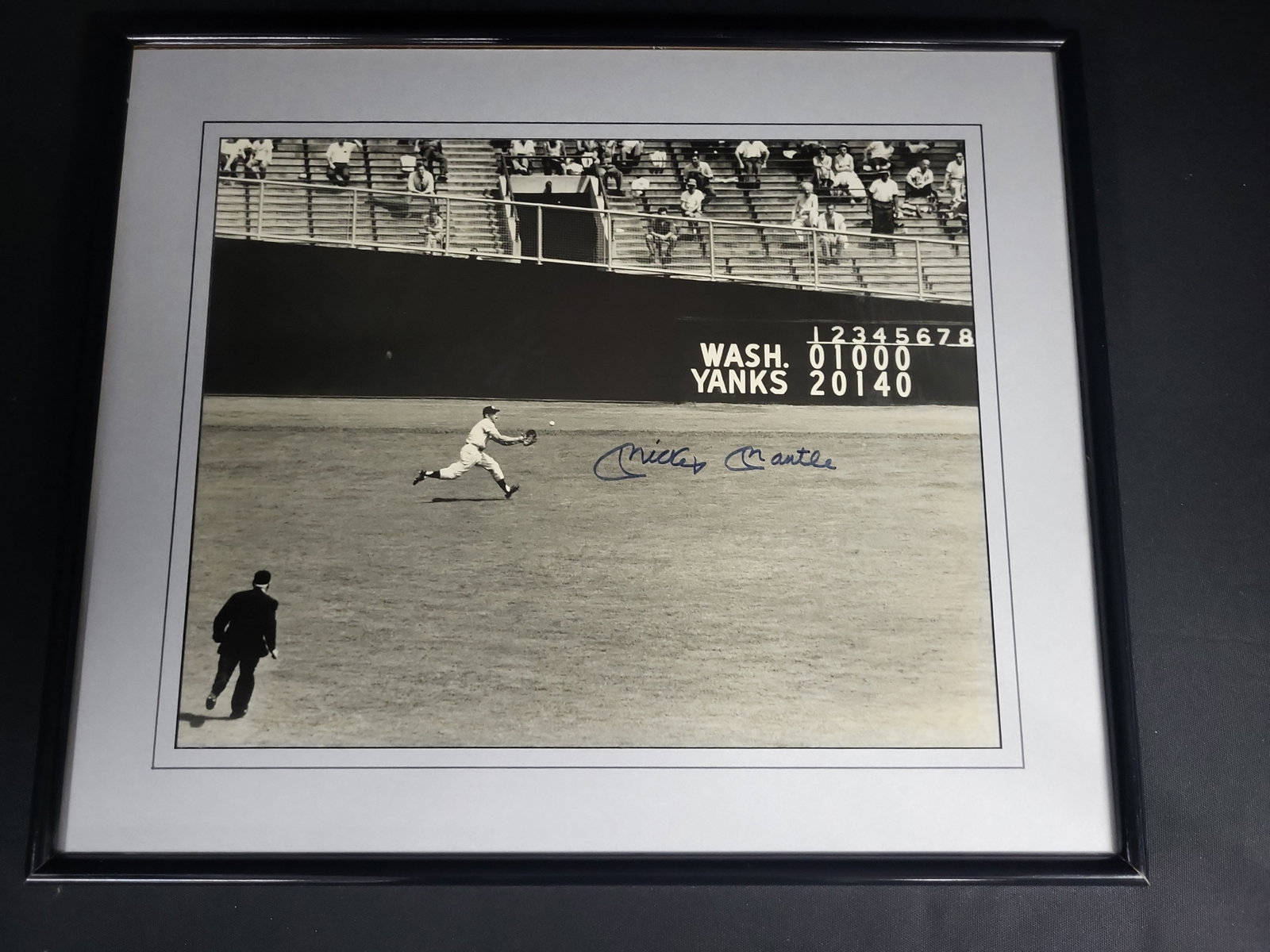 I04861 | Signed Mickey Mantle Action Photograph: IMPORTANT â€“ PLEASE REVIEW BEFORE BIDDING: Aeron House makes every effort to accurately identify and describe each lot; however, titles and descriptions may contain errors, omissions, or AI-a