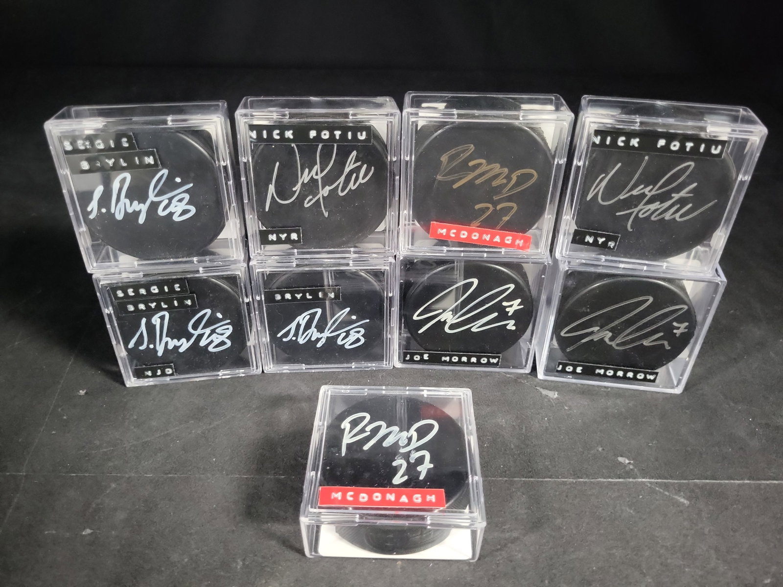 I04369 | Nine SGC Authenticated Signed Hockey Pucks: IMPORTANT â€“ PLEASE REVIEW BEFORE BIDDING: Aeron House makes every effort to accurately identify and describe each lot; however, titles and descriptions may contain errors, omissions, or AI-a