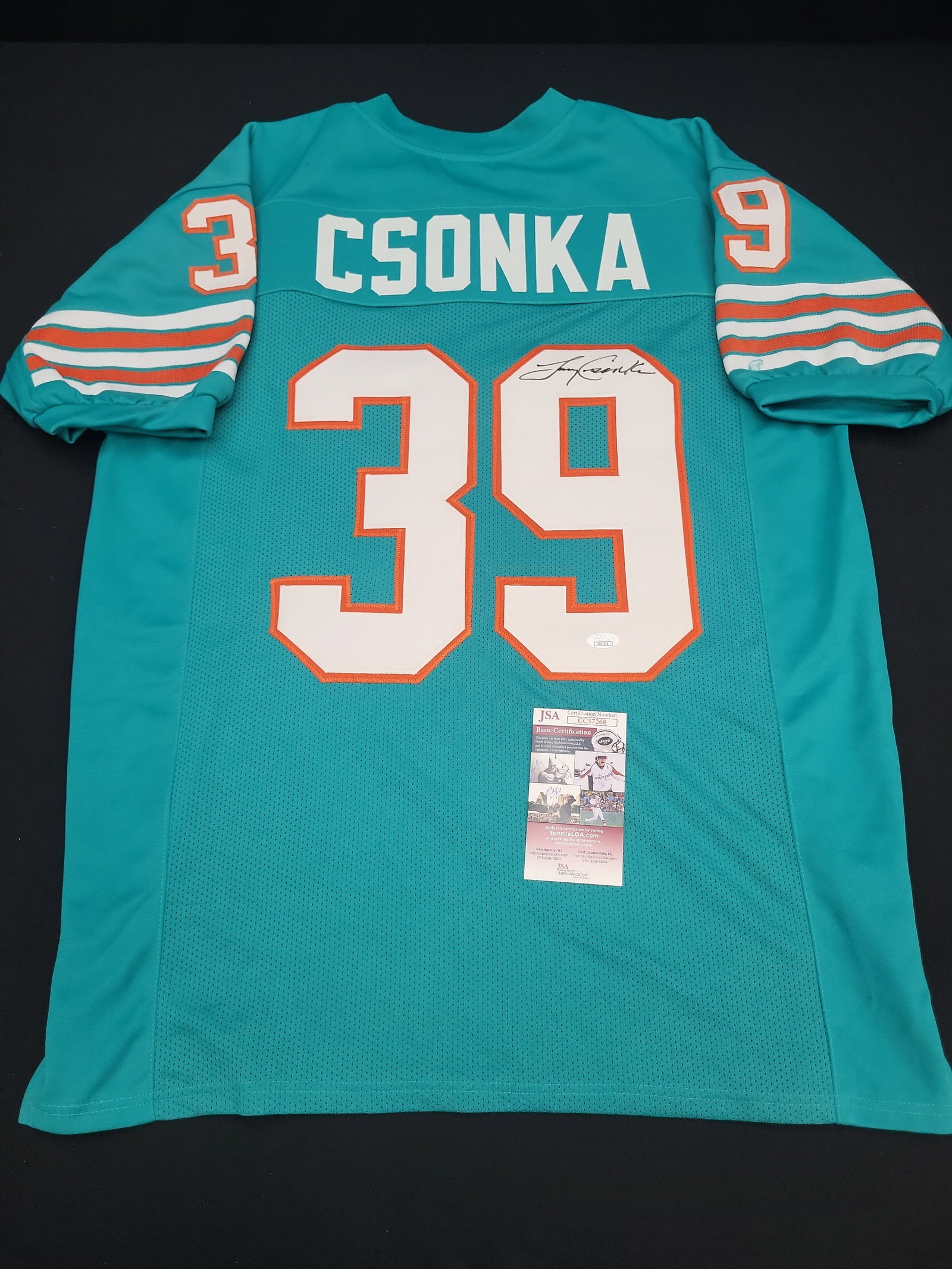 I04862 | Signed Larry Csonka Jersey JSA: IMPORTANT â€“ PLEASE REVIEW BEFORE BIDDING: Aeron House makes every effort to accurately identify and describe each lot; however, titles and descriptions may contain errors, omissions, or AI-a