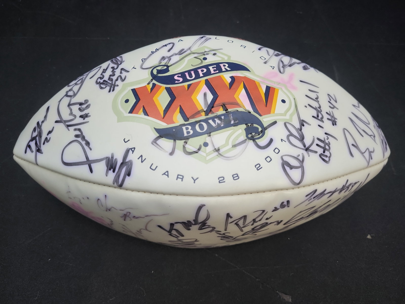 I04104 | Baltimore Ravens Signed Super Bowl XXXV Wilson Football: IMPORTANT â€“ PLEASE REVIEW BEFORE BIDDING: Aeron House makes every effort to accurately identify and describe each lot; however, titles and descriptions may contain errors, omissions, or AI-a