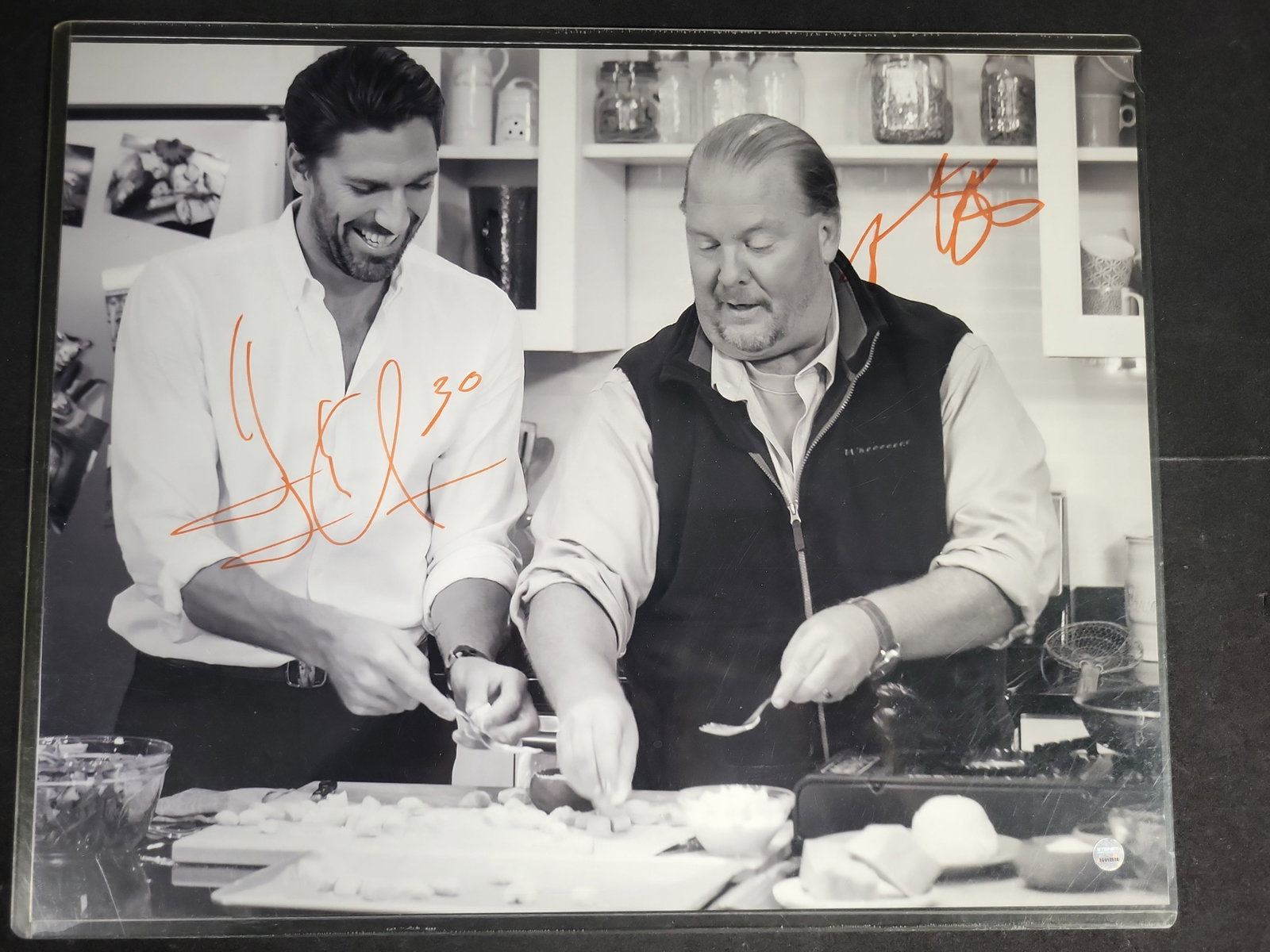 I04383 | Dual Signed Lundqvist and Batali Photo: IMPORTANT â€“ PLEASE REVIEW BEFORE BIDDING: Aeron House makes every effort to accurately identify and describe each lot; however, titles and descriptions may contain errors, omissions, or AI-a