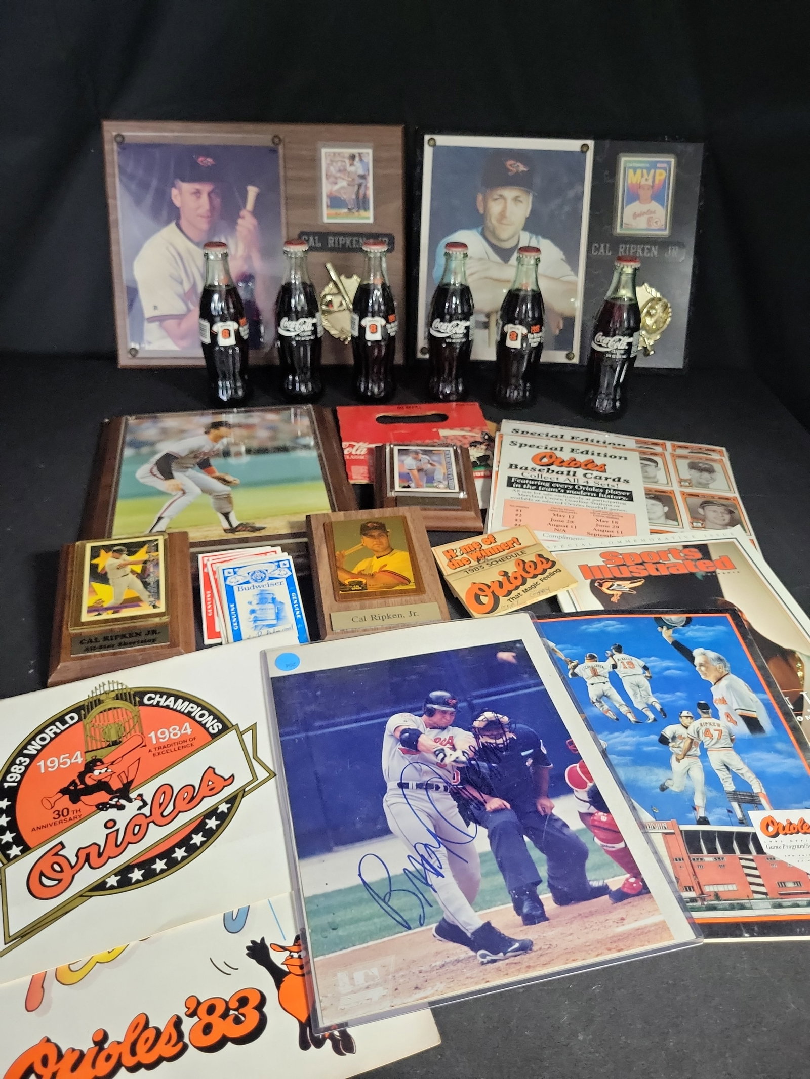 I03941 | Cal Ripken Jr. Orioles Memorabilia Collection: IMPORTANT â€“ PLEASE REVIEW BEFORE BIDDING: Aeron House makes every effort to accurately identify and describe each lot; however, titles and descriptions may contain errors, omissions, or AI-a