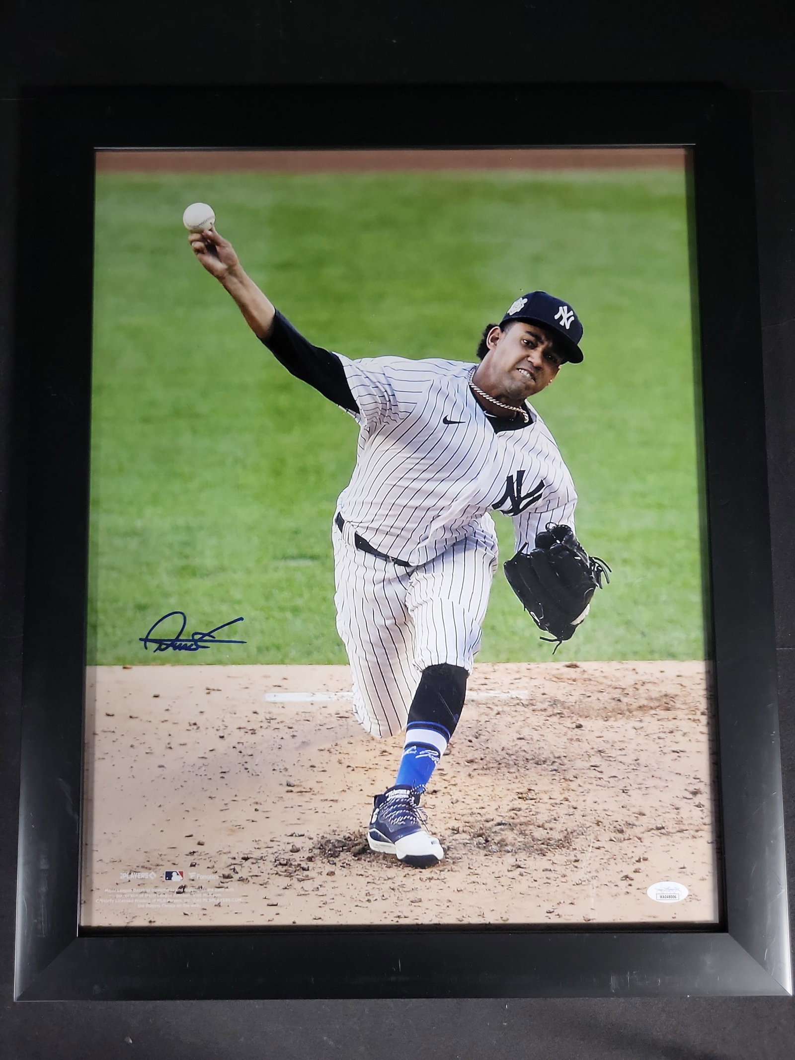 I04372 | Framed Autographed Nestor Cortes Jr. Photograph: IMPORTANT â€“ PLEASE REVIEW BEFORE BIDDING: Aeron House makes every effort to accurately identify and describe each lot; however, titles and descriptions may contain errors, omissions, or AI-a
