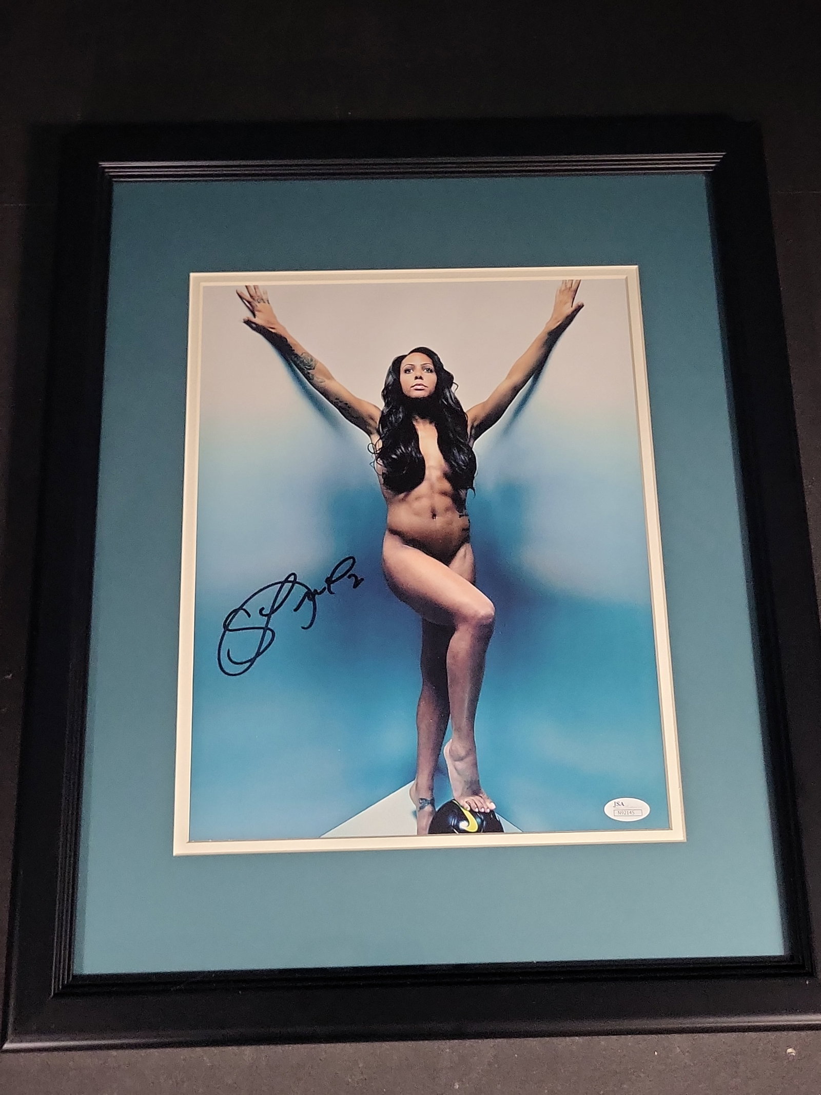I04373 | Framed Sydney Leroux Signed Photograph: IMPORTANT â€“ PLEASE REVIEW BEFORE BIDDING: Aeron House makes every effort to accurately identify and describe each lot; however, titles and descriptions may contain errors, omissions, or AI-a