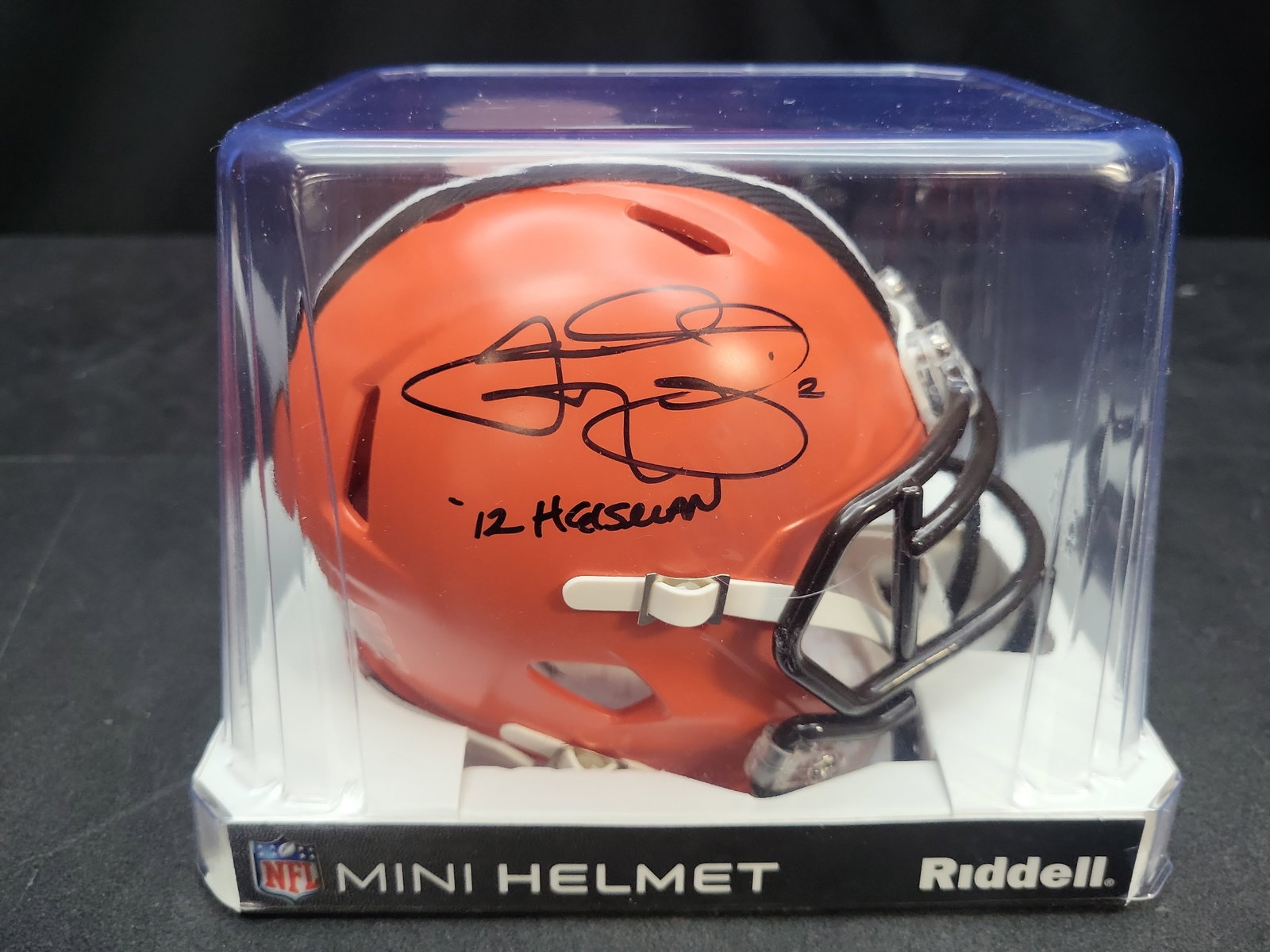 I04700 | Signed Johnny Manziel Browns Mini Helmet Beckett: IMPORTANT â€“ PLEASE REVIEW BEFORE BIDDING: Aeron House makes every effort to accurately identify and describe each lot; however, titles and descriptions may contain errors, omissions, or AI-a