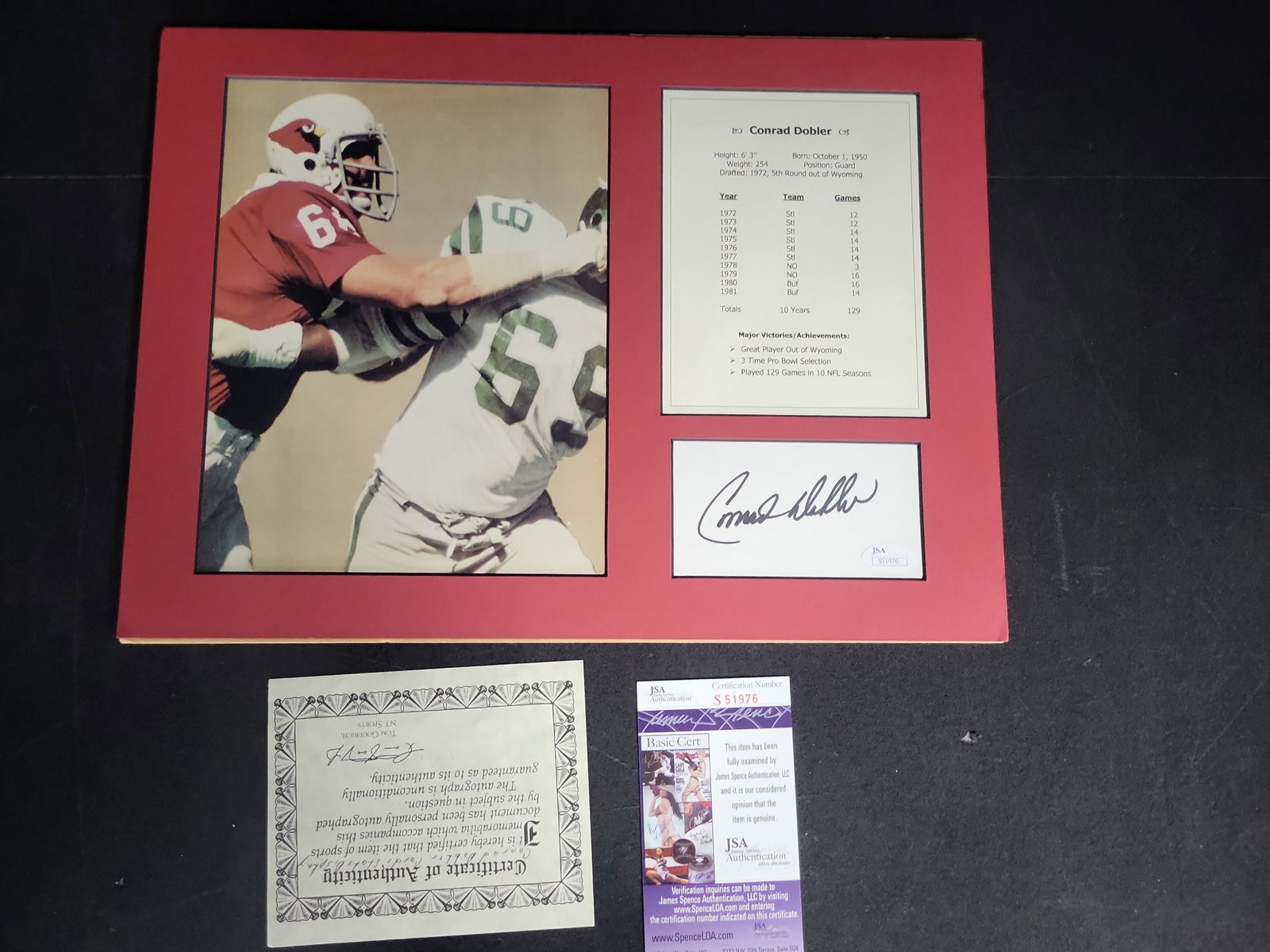 I04333 | Conrad Dobler Autographed Football Display JSA: IMPORTANT â€“ PLEASE REVIEW BEFORE BIDDING: Aeron House makes every effort to accurately identify and describe each lot; however, titles and descriptions may contain errors, omissions, or AI-a
