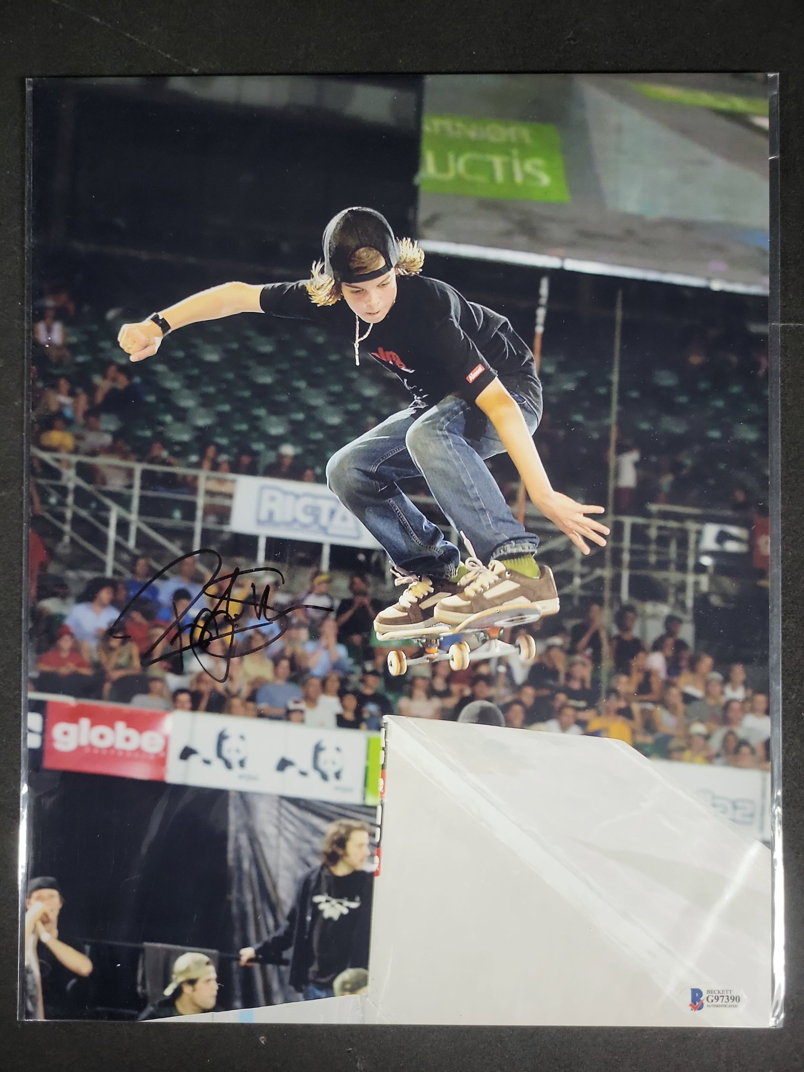 I04449 | Signed Ryan Sheckler Skateboard Action Photograph: IMPORTANT â€“ PLEASE REVIEW BEFORE BIDDING: Aeron House makes every effort to accurately identify and describe each lot; however, titles and descriptions may contain errors, omissions, or AI-a