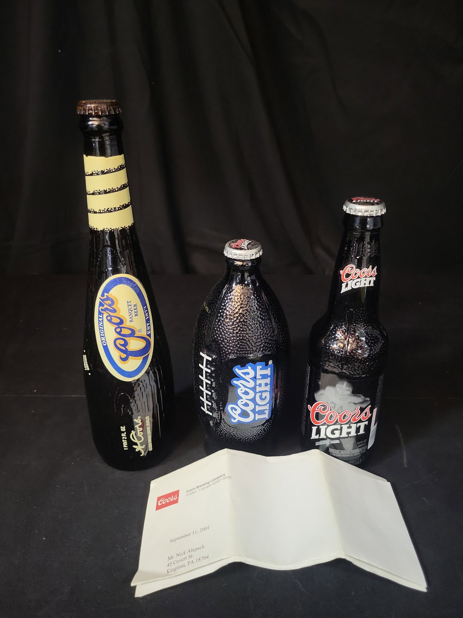 I03053 | A Trio of Coors Brewing Company Commemorative Sports Themed Specialty Bottles: IMPORTANT â€“ PLEASE REVIEW BEFORE BIDDING: Aeron House makes every effort to accurately identify and describe each lot; however, titles and descriptions may contain errors, omissions, or AI-a