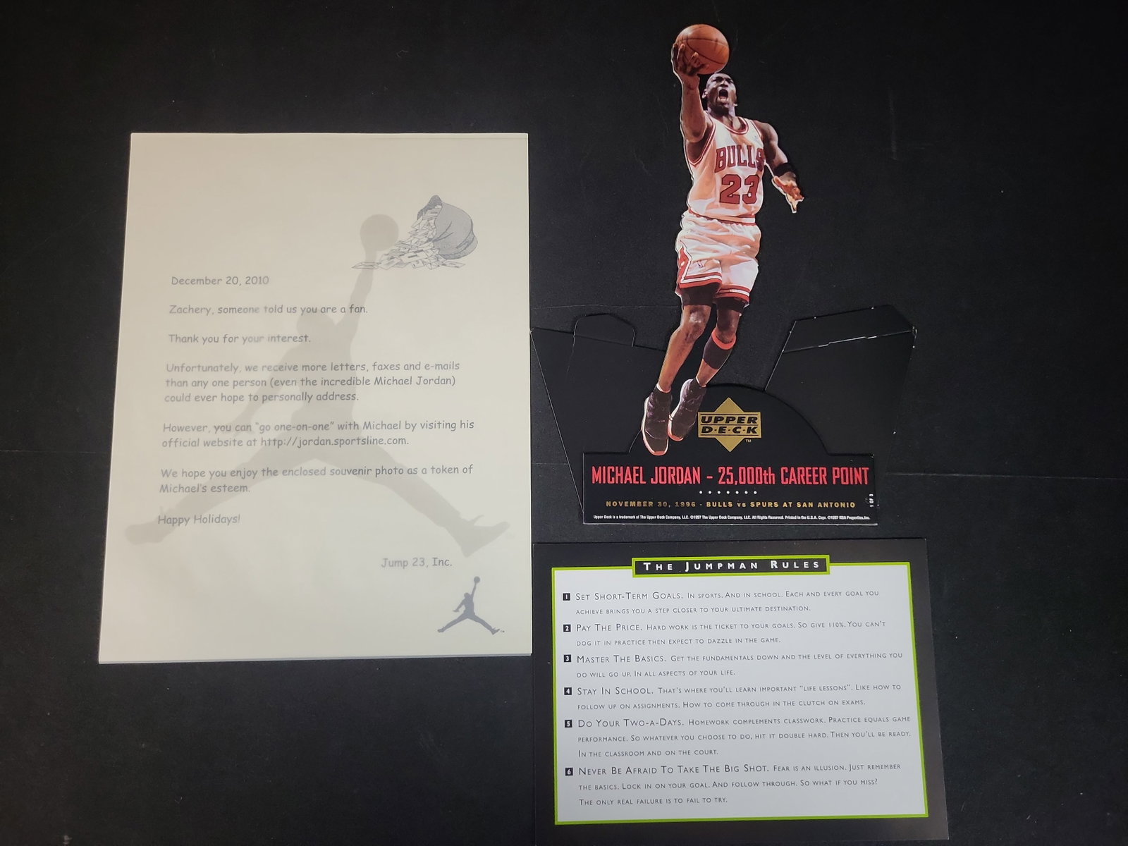 I03028 | A Trio of Michael Jordan Memorabilia Including a 1997 Upper Deck Commemorative Standee and: IMPORTANT â€“ PLEASE REVIEW BEFORE BIDDING: Aeron House makes every effort to accurately identify and describe each lot; however, titles and descriptions may contain errors, omissions, or AI-a
