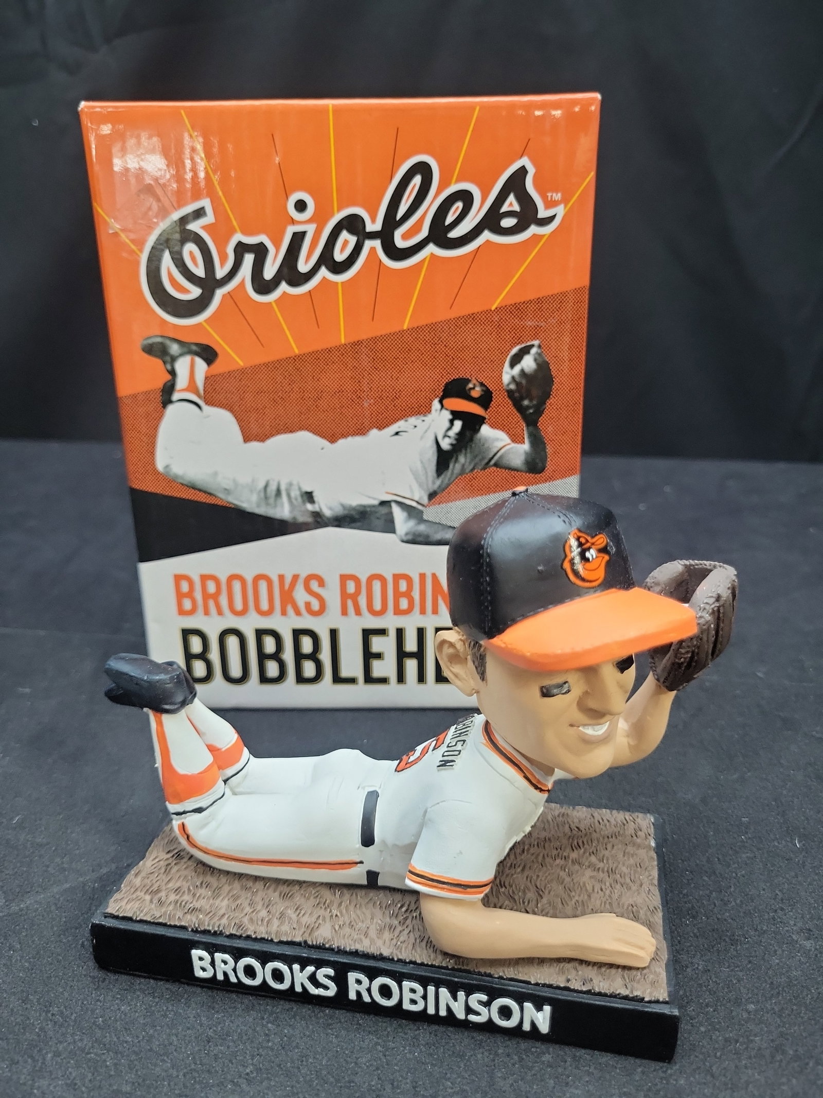 I03940 | Brooks Robinson Baltimore Orioles Bobblehead: IMPORTANT â€“ PLEASE REVIEW BEFORE BIDDING: Aeron House makes every effort to accurately identify and describe each lot; however, titles and descriptions may contain errors, omissions, or AI-a