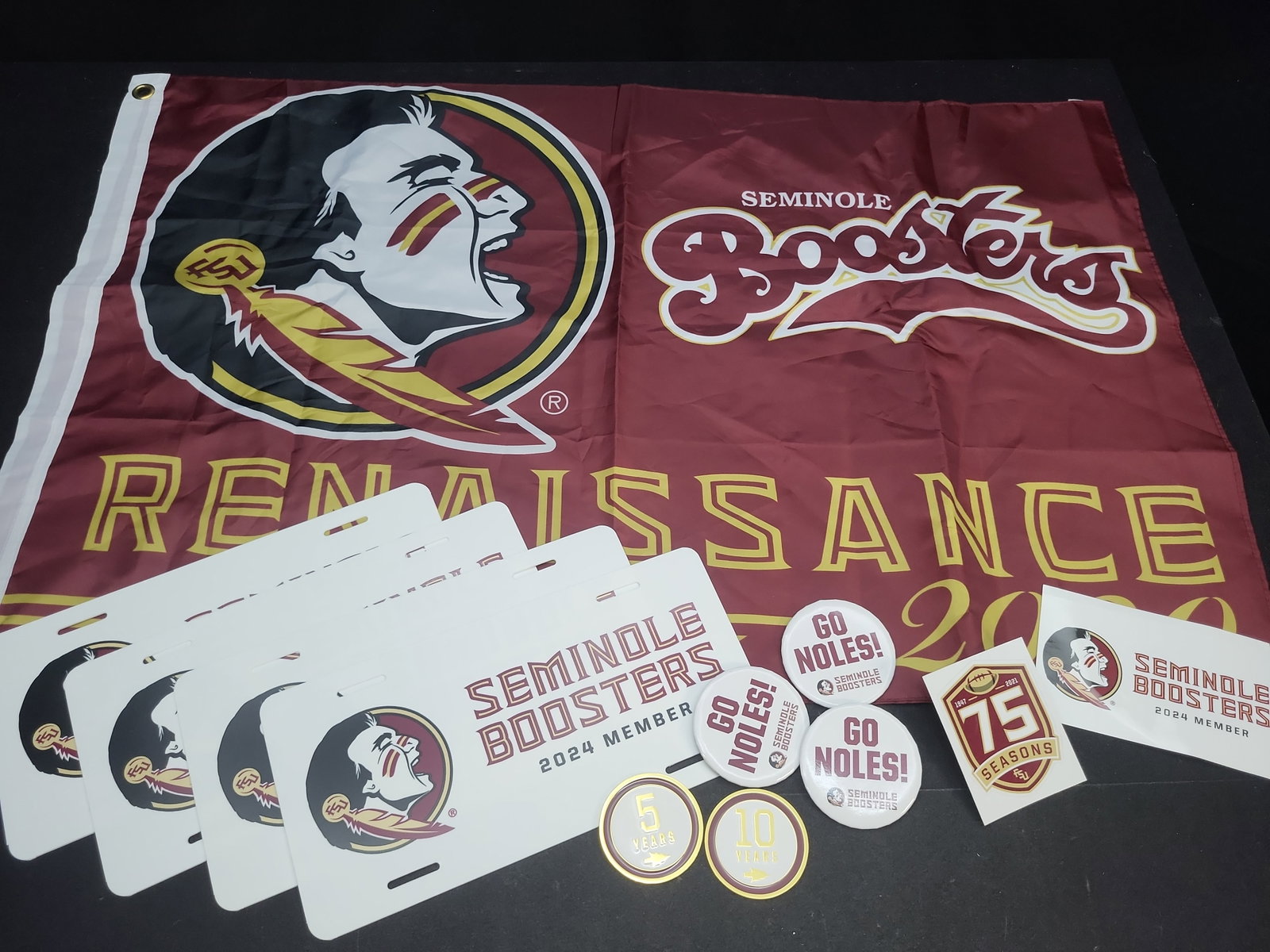 I04718 | FSU Seminole Boosters Memorabilia Collection: IMPORTANT â€“ PLEASE REVIEW BEFORE BIDDING: Aeron House makes every effort to accurately identify and describe each lot; however, titles and descriptions may contain errors, omissions, or AI-a