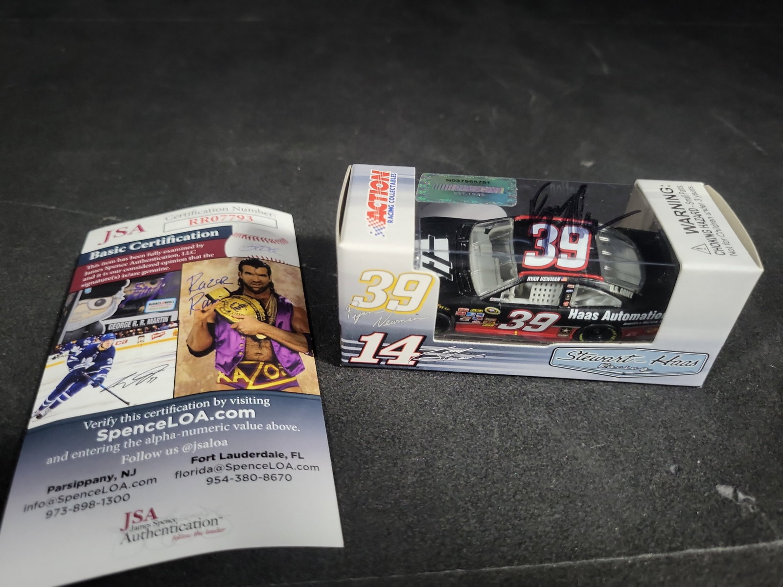 I04458 | Autographed Ryan Newman Haas Die-cast Car: IMPORTANT â€“ PLEASE REVIEW BEFORE BIDDING: Aeron House makes every effort to accurately identify and describe each lot; however, titles and descriptions may contain errors, omissions, or AI-a