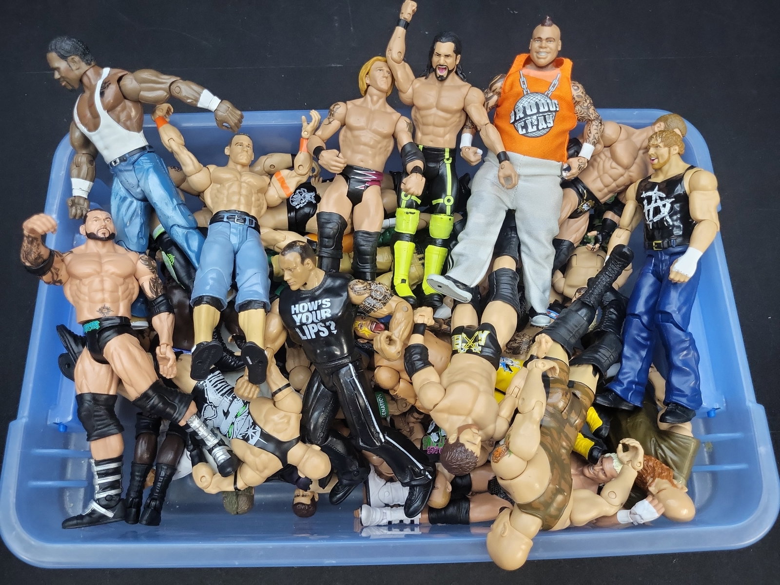 I04295 | Assorted WWE Action Figure Collection: IMPORTANT â€“ PLEASE REVIEW BEFORE BIDDING: Aeron House makes every effort to accurately identify and describe each lot; however, titles and descriptions may contain errors, omissions, or AI-a