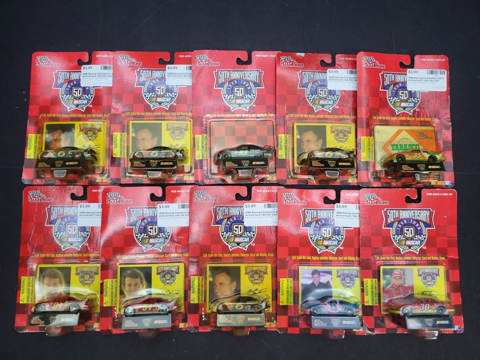 I04747 | Racing Champions NASCAR 50th Anniversary Collection: IMPORTANT â€“ PLEASE REVIEW BEFORE BIDDING: Aeron House makes every effort to accurately identify and describe each lot; however, titles and descriptions may contain errors, omissions, or AI-a