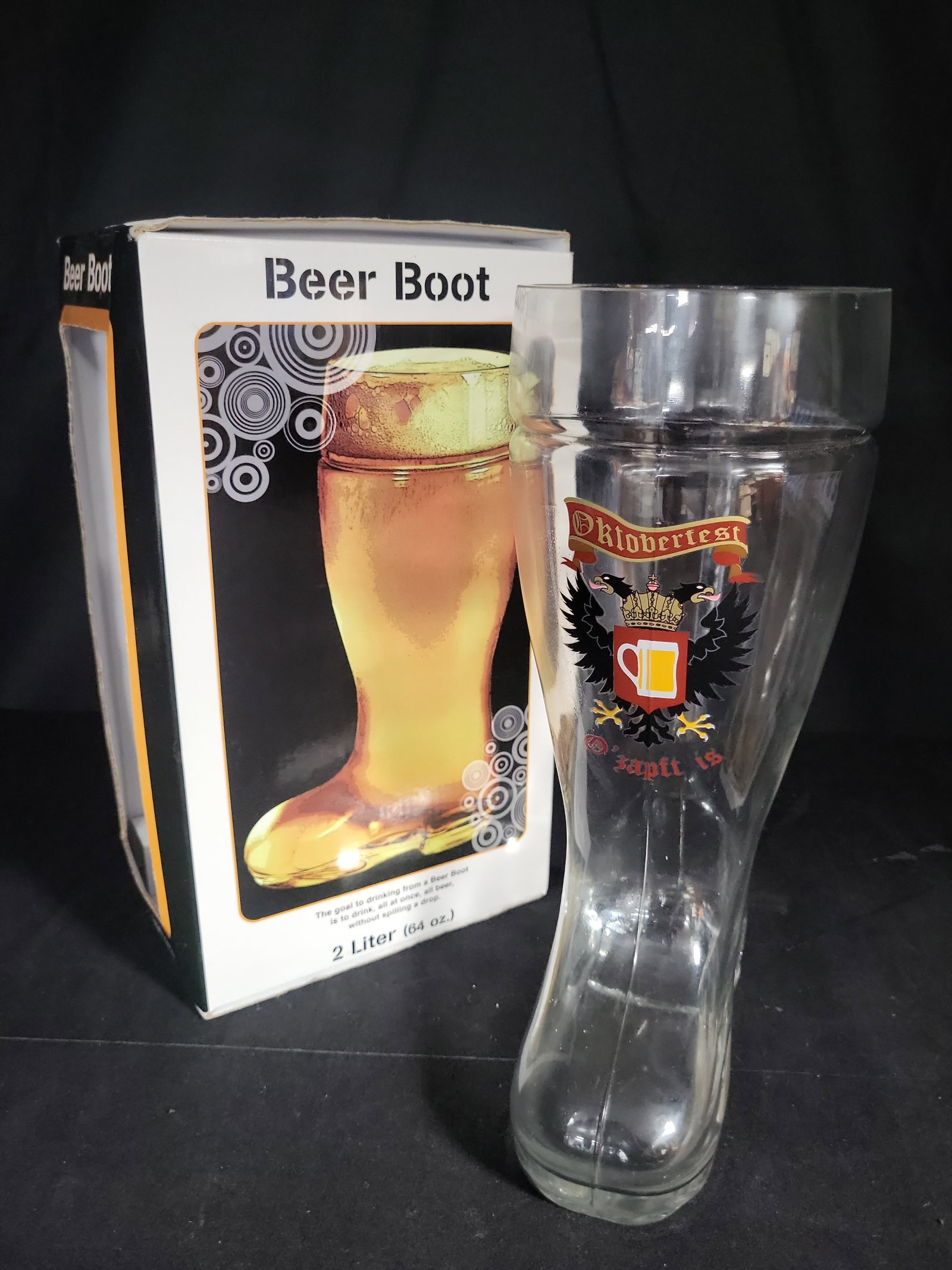 I04667 | Large 2 Liter Oktoberfest Beer Boot: IMPORTANT â€“ PLEASE REVIEW BEFORE BIDDING: Aeron House makes every effort to accurately identify and describe each lot; however, titles and descriptions may contain errors, omissions, or AI-a