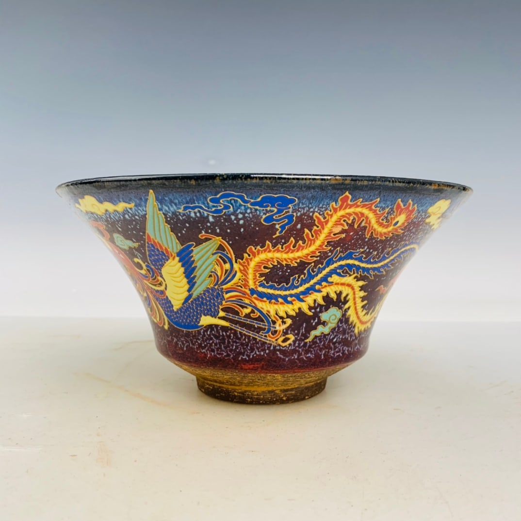 Jian kiln dragon and phoenix pattern teacup: Jian kiln dragon and phoenix pattern teacup. Height 10CM Width20CM Freight: 1.International Freight: Foreign shipping charges are determined by destination. 2.Photos, descriptions and valuations have