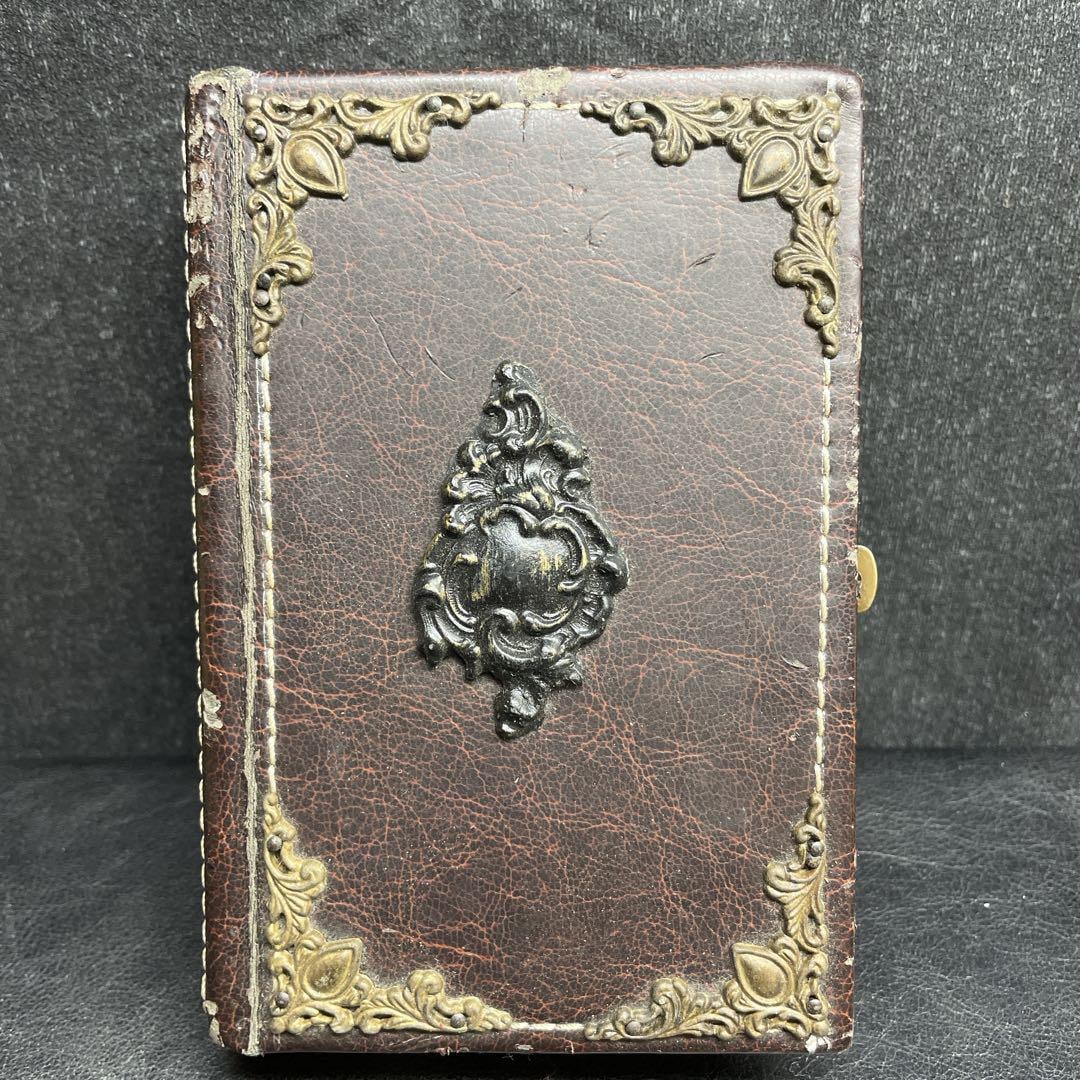 Rare French antique book box: This is an antique French book box.This unusual box is shaped like a book and can be used to store jewelry, small items, etc.It looks like a real Western book, and the bronze relief details on the lea