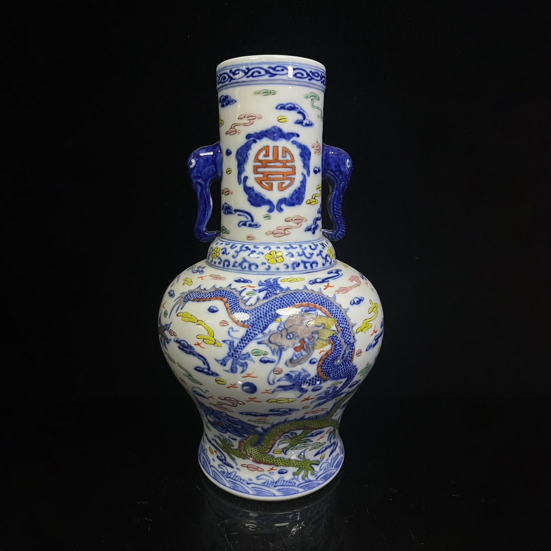 A Qing Dynasty Qianlong-style vase with double elephant ears and a five-color dragon and auspicious: A Qing Dynasty Qianlong-style vase with five-colored coiled dragon and auspicious cloud patterns and double elephant ears. Height 40cm, belly diameter 21cm Freight: 1.International Freight: Foreign sh