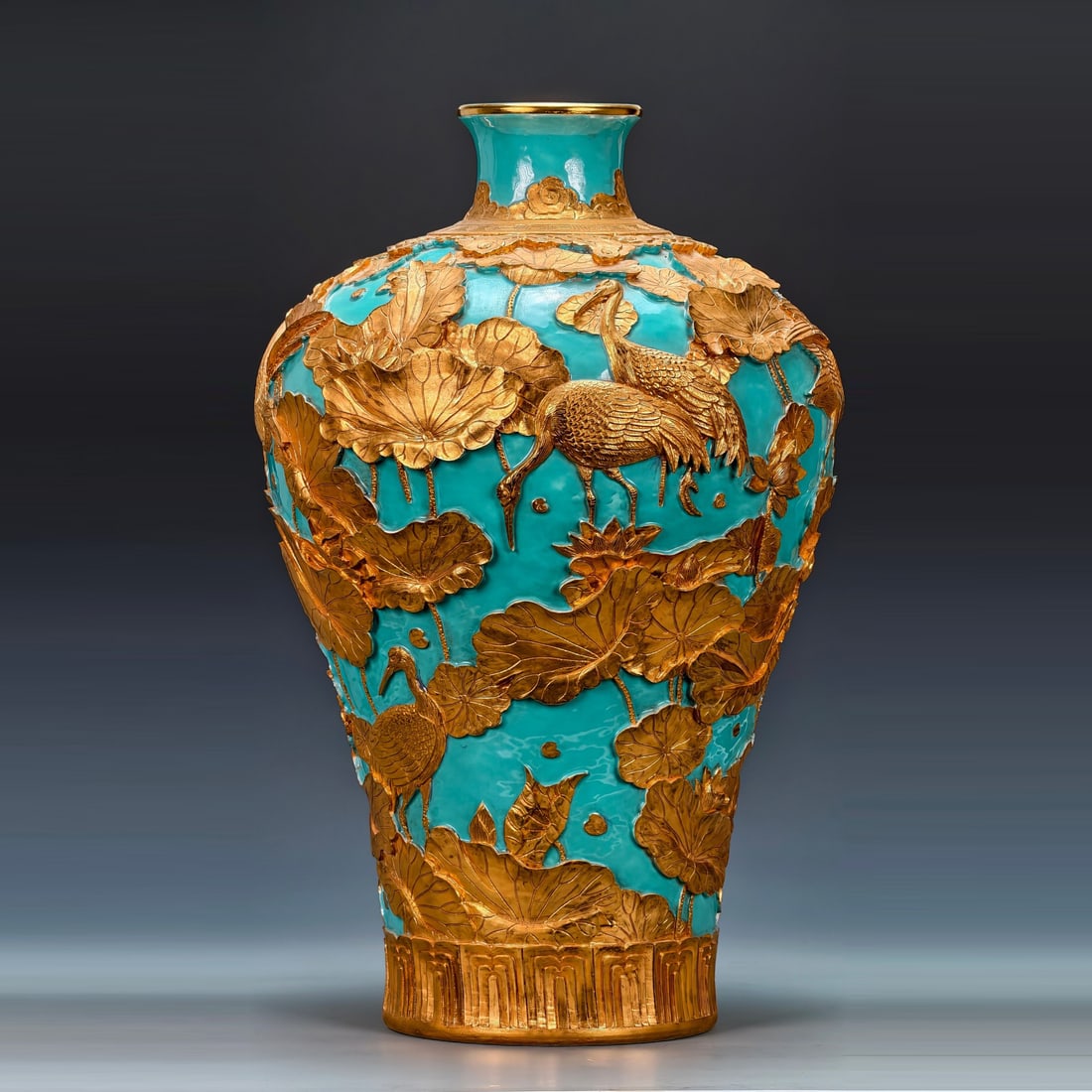 Qing Dynasty style lotus pond crane pattern meiping: Qing dynasty style Qianlong period celadon base with gold-filled colors and high relief carved porcelain 'Lotus Pond and Cranes' pattern meiping vase. During the Qianlong era, the development of vario