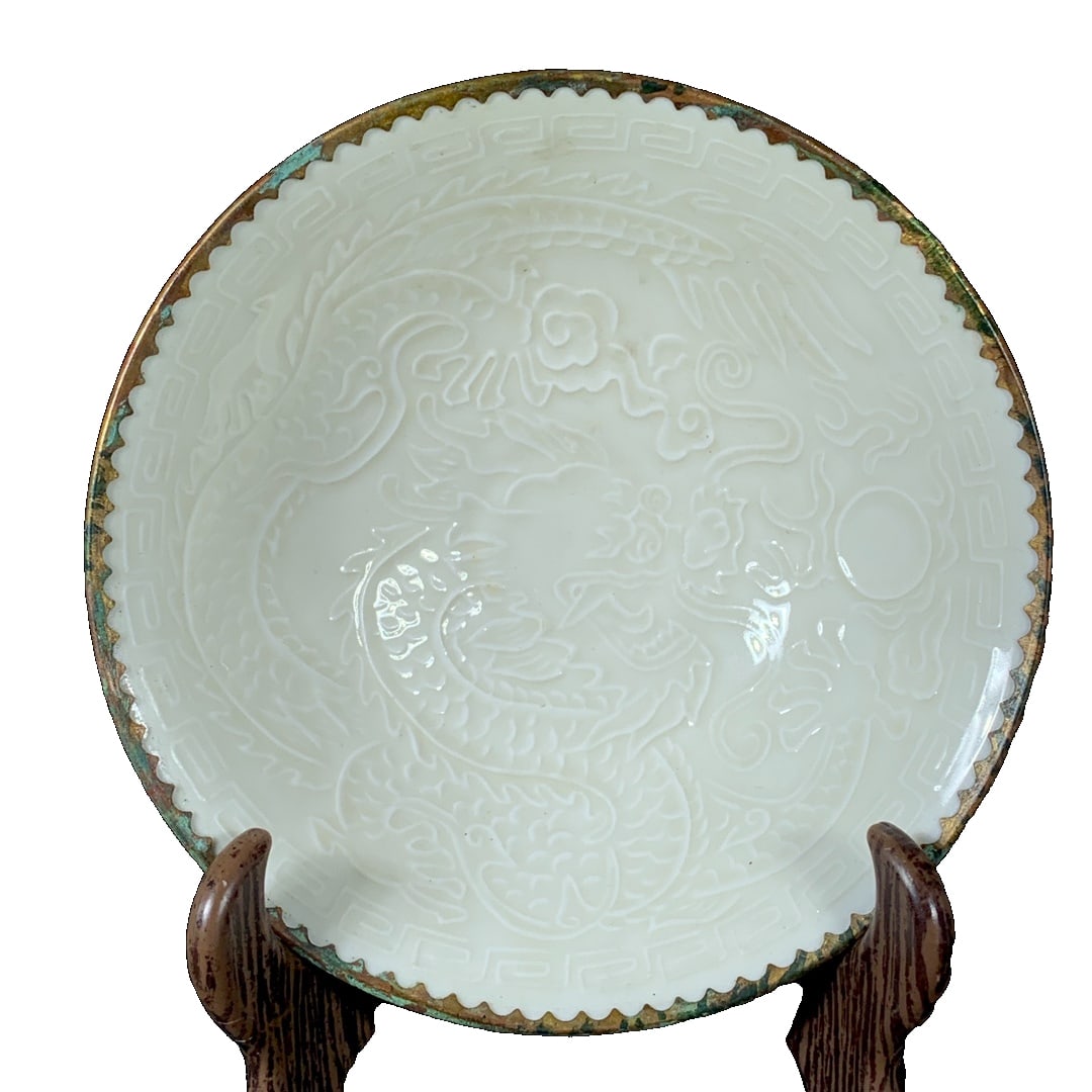 Song Dynasty Ding Kiln Gold-inlaid Mouth Child Pattern Bowl: This Northern Song Dynasty Ding Kiln gold-plated mouth child pattern bowl, 4.5 centimeters in height and 14.5 centimeters in diameter, attracts collectors with its unique craftsmanship and historical