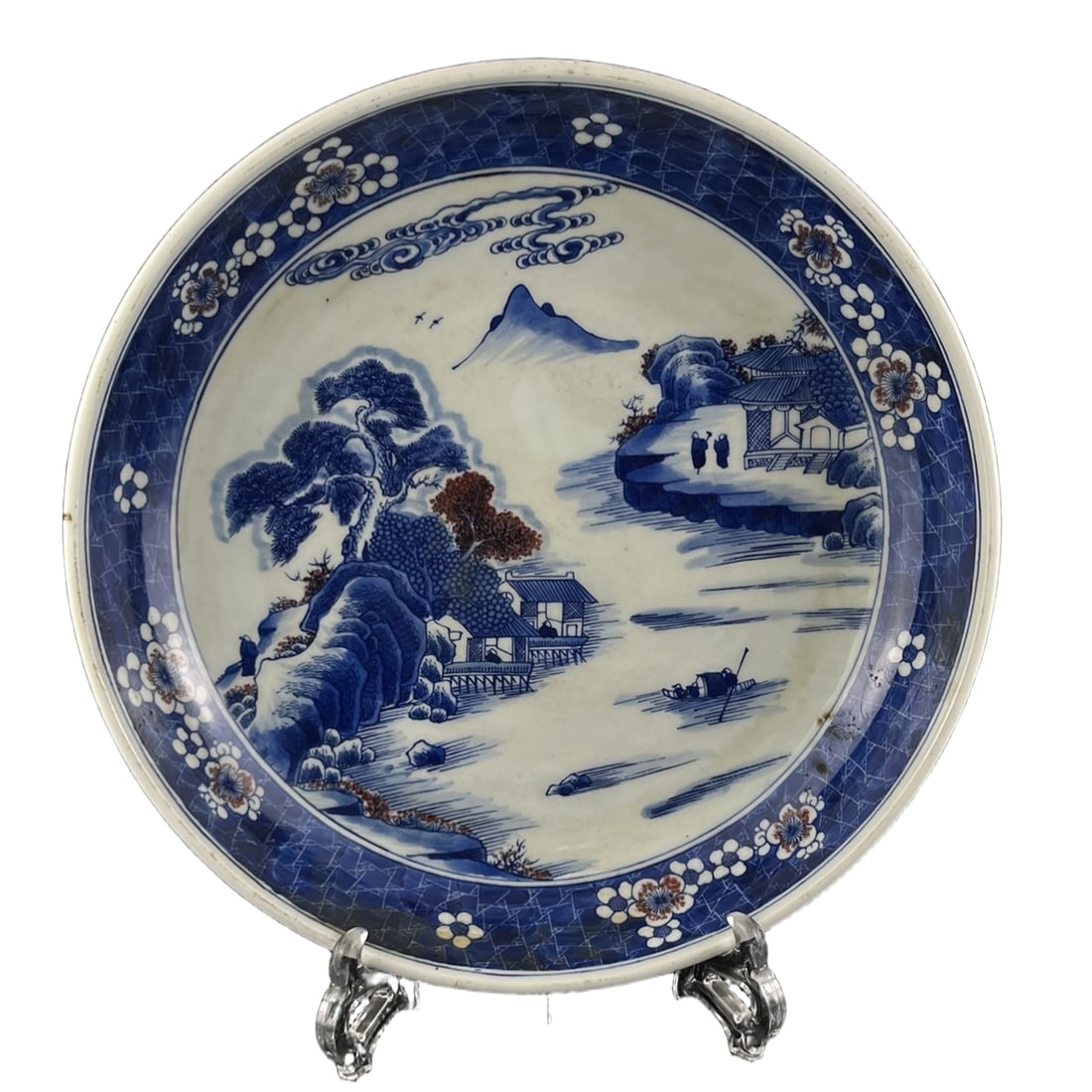 Kangxi Multi-character Mark Landscape Decorative Plate: This Qing Kangxi period blue and white porcelain plate, with a diameter of 29 centimeters and a height of 6 centimeters, is a typical example of blue and white ware, reflecting the elegant style of th