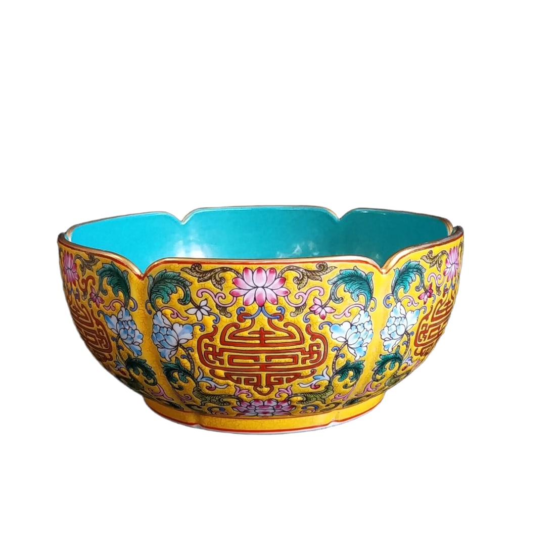 Qing Yongzheng Famille Rose Floral Gilt Bowl: This is a cloisonné enamel and gold-painted bowl from the Yongzheng period of the Qing Dynasty. It features a well-proportioned shape and smooth lines, showcasing the imperial demeanor. The bowl is a