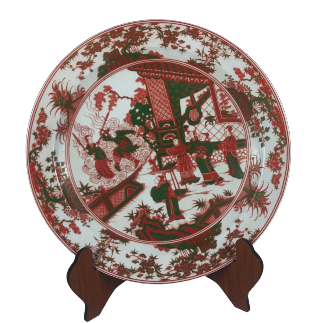 A Qing Dynasty Kangxi Emperor's Hand-Painted Figure and Story Pattern Appreciation Plate: A large underglaze red and green glazed porcelain plate from the Kangxi era of the Qing Dynasty, featuring hand-painted figures and stories. The pattern is clear and smooth. The condition is as shown