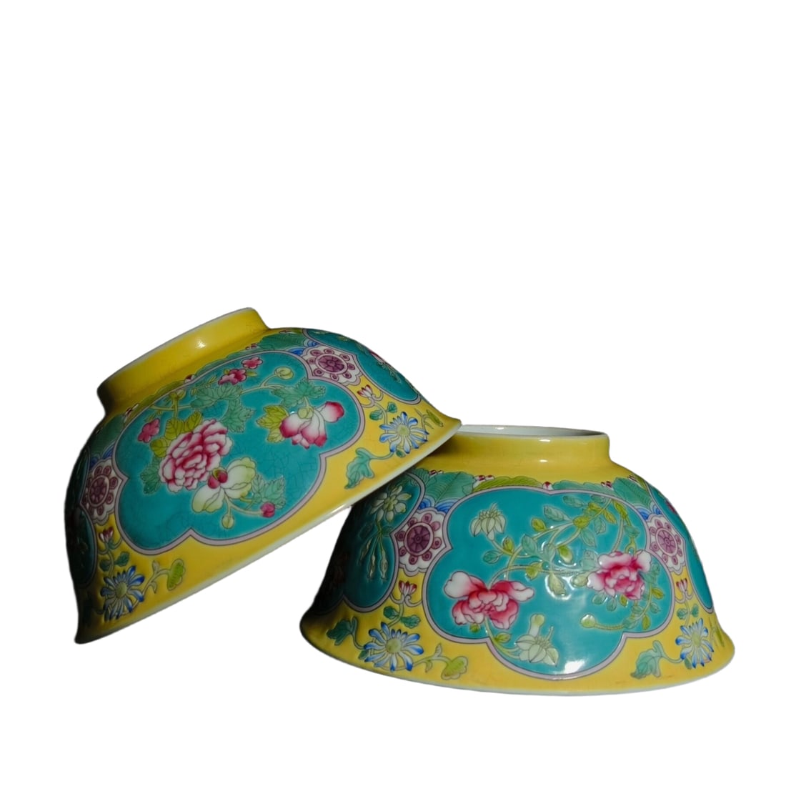 Pair of Kangxi Enamelled Floral Bowls: A pair of hand-painted enamel flower bowls from the Kangxi era, each 7 cm high with a mouth diameter of 15 cm Freight: 1.International Freight: Foreign shipping charges are determined by destination.