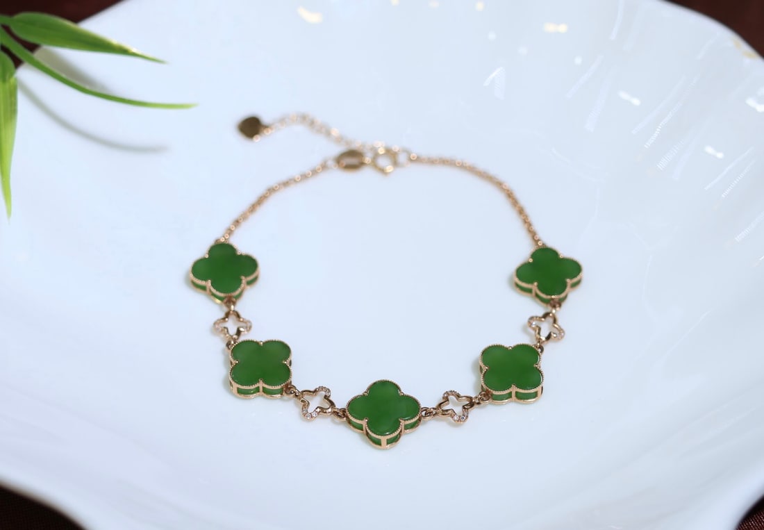 18K Rose Gold Inlaid Jade Bracelet: 18K Rose Gold Exquisite Inlay Jade Bracelet with Heavy Gold and Diamonds Jade Surface Size: 10mm*5 Clover Shape Clean and Jade Quality Beautiful Color and Elegant Design 1.International Freight: