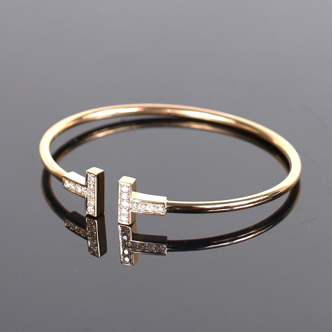 Second-hand Tiffany & Co. T-bar Diamond Bracelet: Tiffany & Co. T-shaped diamond bracelet, PG approximately 14.5-15.0 cm, weighs about 7.6 grams. PG (Pink Gold) Note: The diamonds have visible imperfections with some signs of wear. Although the produ