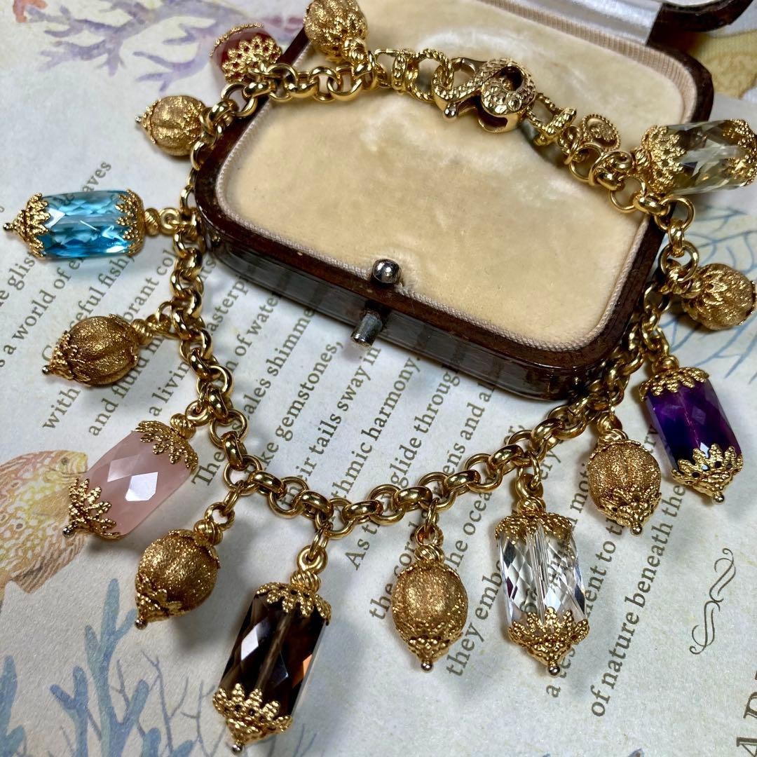 Second-hand 18K Italian GARFARINO MARIO Bracelet: 18K Italian GARFARINO MARIO Bracelet - Approximately 19 centimeters longAlthough there are no gemstone carvings, the bracelet includes amethyst, citrine, agate, blue topaz, rose quartz, and smoky quar