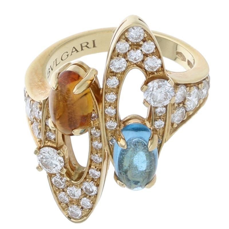 Second-hand Elysia 18K Yellow Gold Yellow Crystal and Blue Topaz Ring: Elysia 18K Yellow Gold Ring with Citrine and Blue Topaz for Women, Size 10Size Details Inner Diameter: Approximately 15.88 mmCondition Grade A (minor signs of use)Accessories Included with a storage b