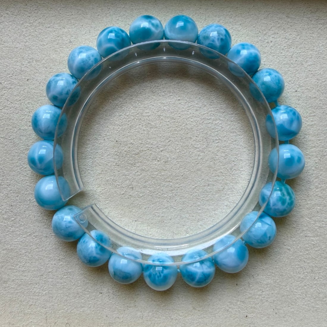 Natural Larimar Bracelet: This natural lapis lazuli bracelet measures 9mm, showcasing a sky-blue color with large turtle back patterns, almost fully patterned, completely agatized, a rare piece of excellence, weighing 24 grams