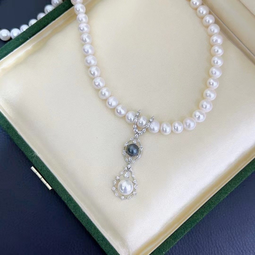 Pearl Pendant Necklace Set: This exquisite necklace set features double pearl pendants with a unique marquise design that adds a touch of elegance to any outfit. The versatile clasp allows the wearer to customize the look, perfe