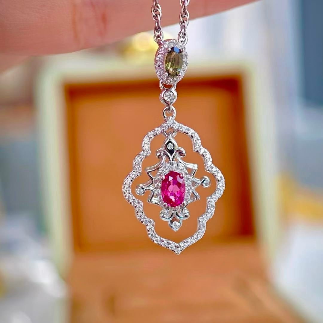 925 Silver Natural Red Tourmaline Pendant: This pendant captures the essence of elegance with its exquisite design, featuring a natural red tourmaline that exudes warmth and charm. The embellishment of green tourmaline complements the main