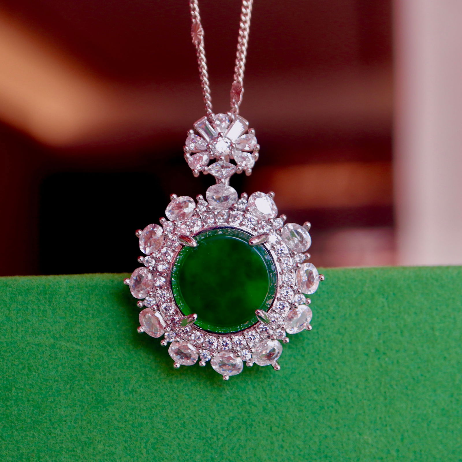 Natural jadeite round pendant: This natural jade round pendant is captivating with its full green color and elegant design. The exquisite craftsmanship is evident in every detail, making it a truly stunning piece that exudes an air