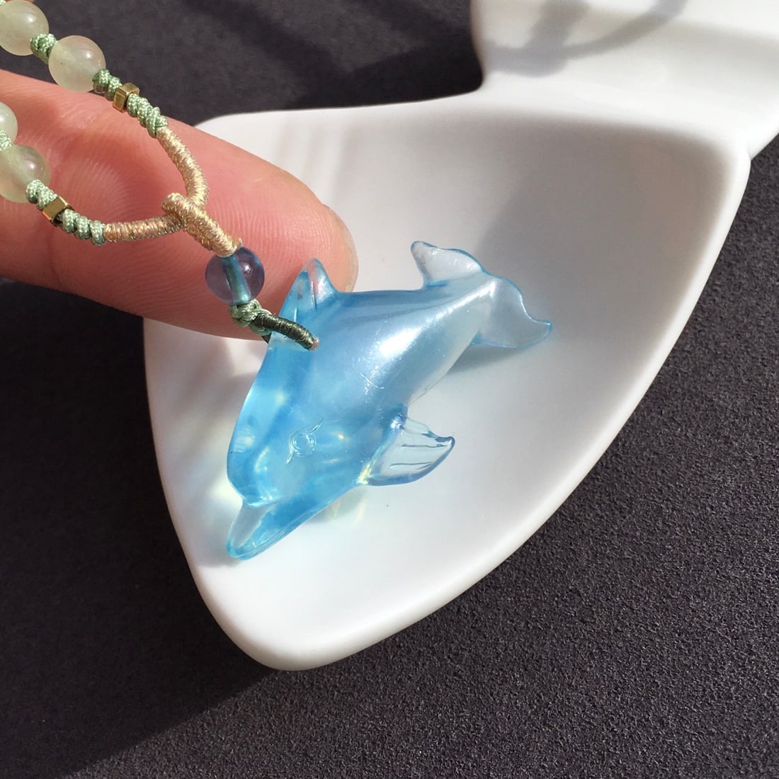 Aquamarine Carved Dolphin Pendant: This turquoise carving dolphin pendant showcases the beauty of the ocean with its captivating Saint Maria blue color. The transparency of the crystal enhances the intricate details of the dolphin carv