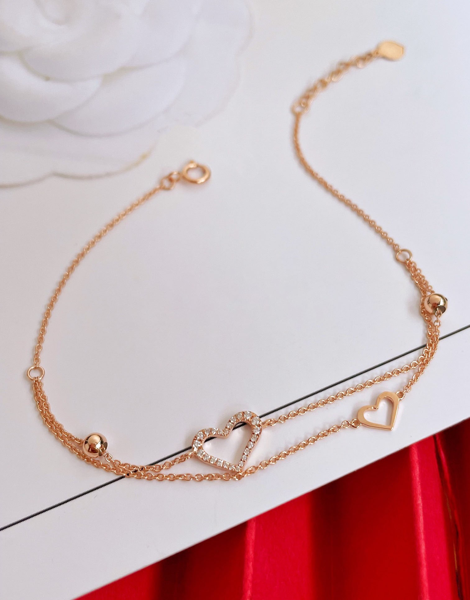 18k Diamond Double Heart Bracelet: This exquisite 18k diamond double-layer heart bracelet perfectly showcases youthful elegance and charm. The double-layer design adds a touch of sophistication, with delicate little hearts sparkling wi