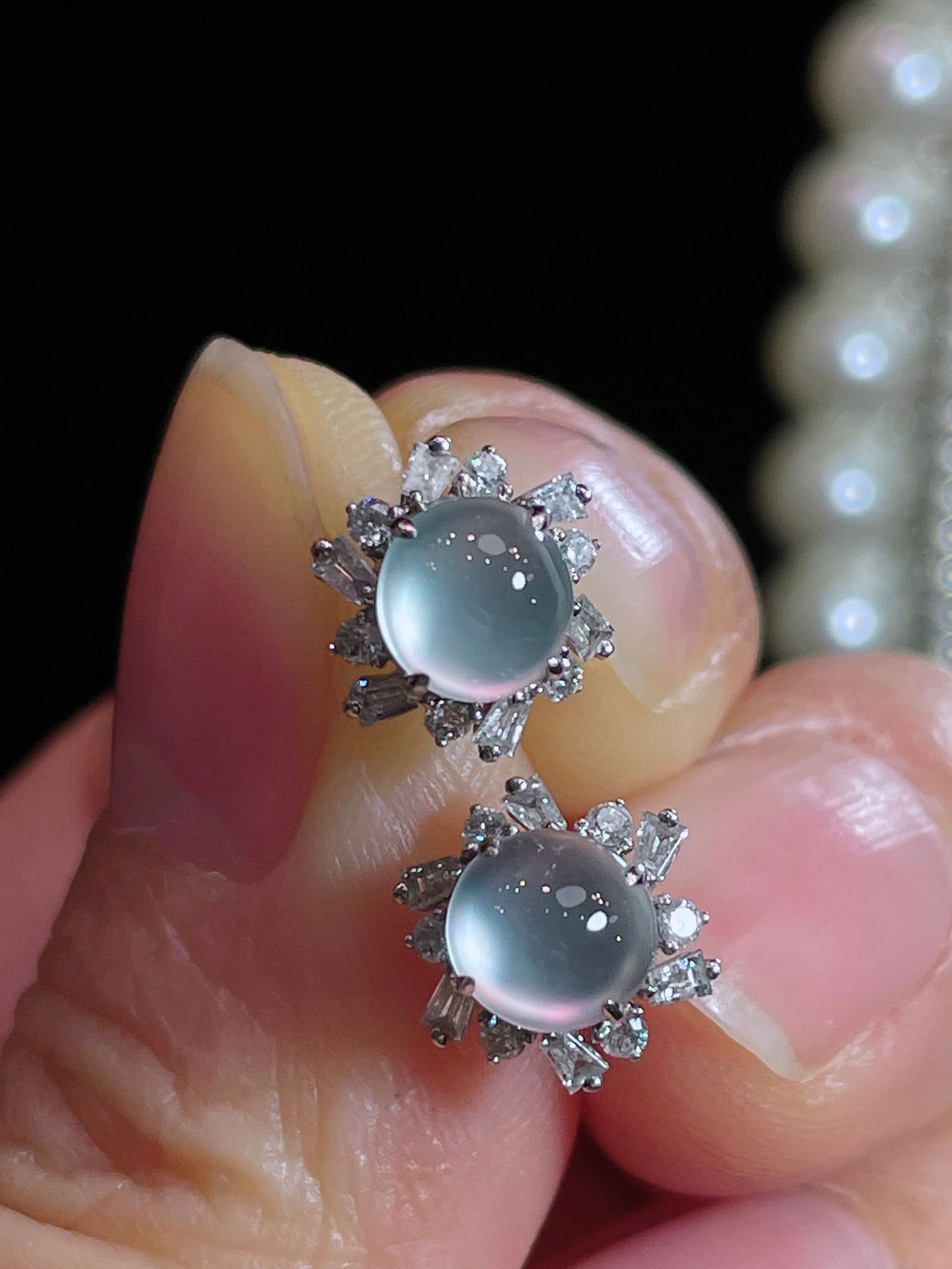 18k Gold White Ice Jadeite Earrings: This exquisite pair of earrings perfectly combines the elegance of 18k gold with the tranquil charm of white jade. The delicate craftsmanship is highlighted by the sparkling diamonds surrounding the j