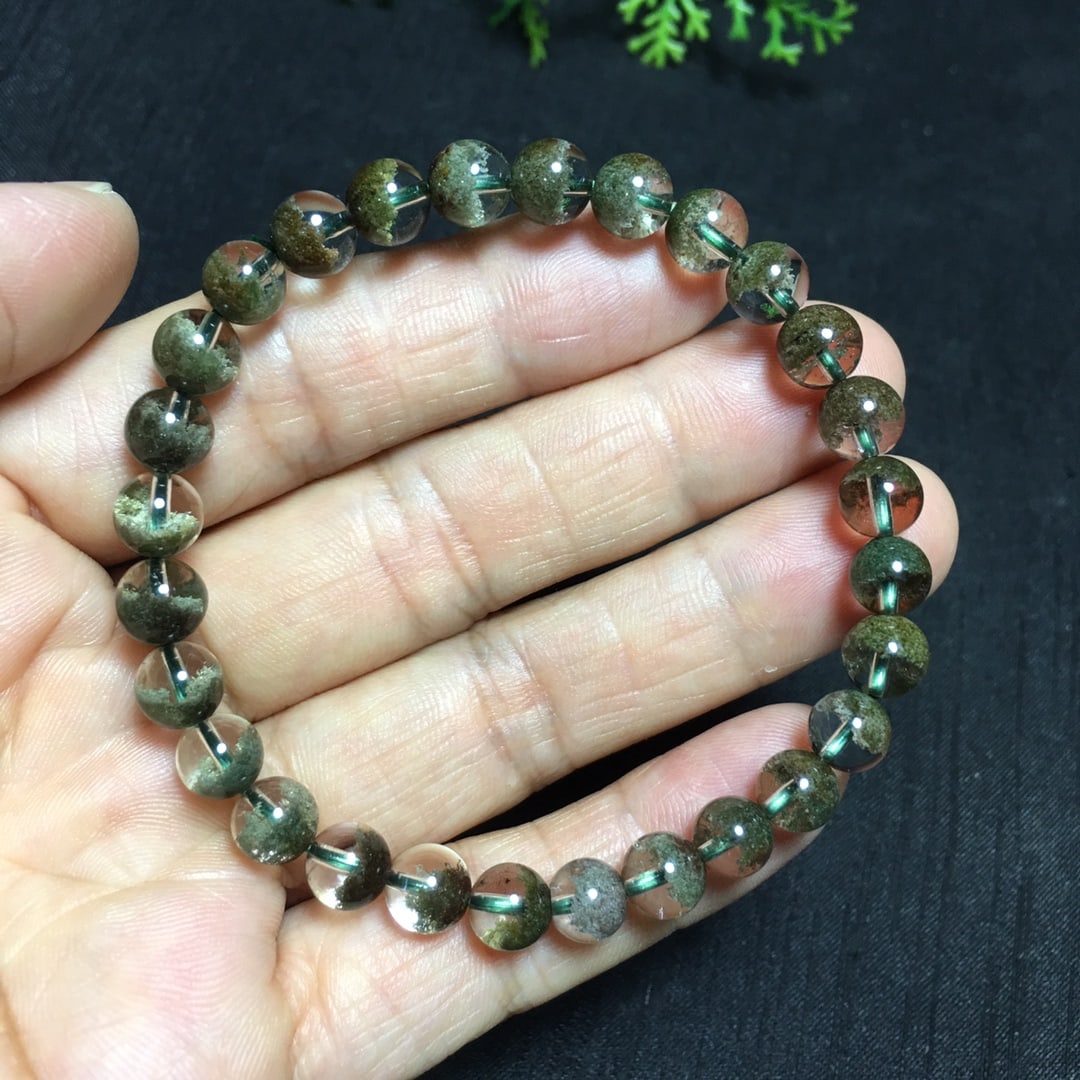 Natural Treasure Bowl Bracelet: This bracelet showcases the exquisite beauty of natural Brazilian Green Phantom, with each bead carefully crafted to perfection. The 6.8mm beads demonstrate superb craftsmanship, with their crystal-cl