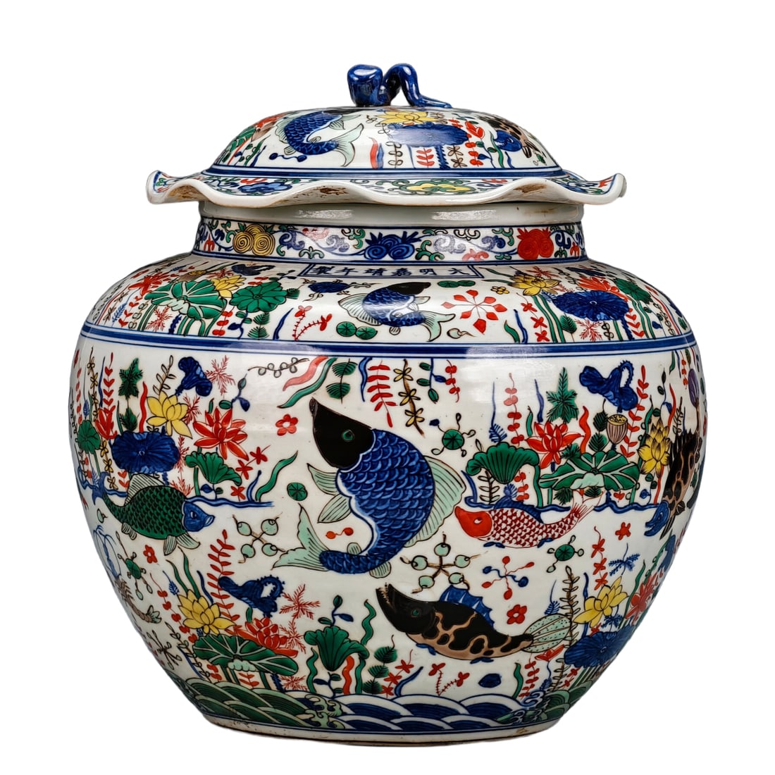 Ming Jiajing Blue and White Polychrome Lotus Leaf Jar: Made during the Jiajing period of the Ming Dynasty, this blue and white porcelain jar with polychrome full-body painted 'Lotus Pond Fish Algae' pattern. The body of the jar is entirely decorated with