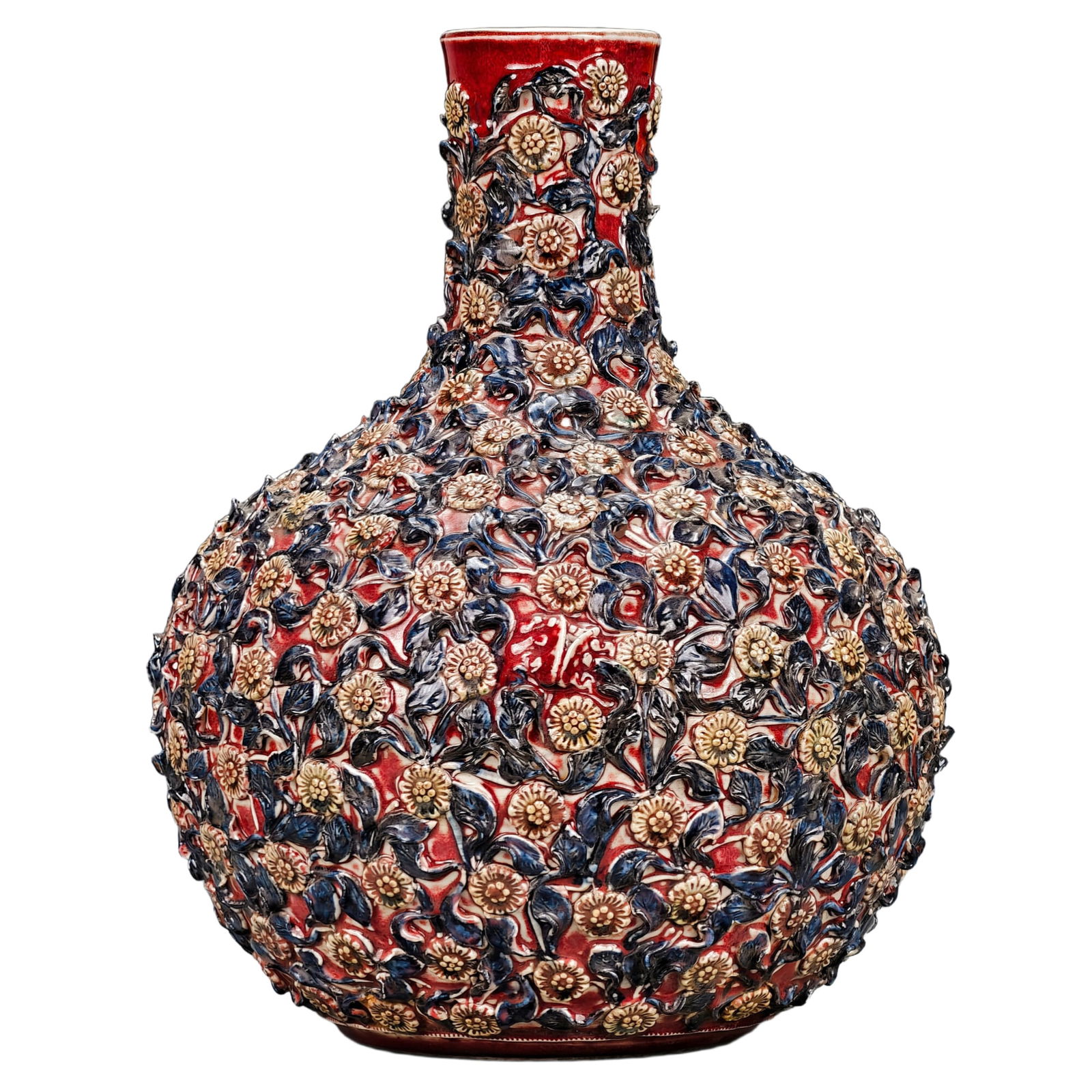Ming Dynasty Red Glaze Blue and White Celestial Sphere Vase: A fine Ming Dynasty red-glazed blue and white celestial sphere bottle, meticulously crafted with a full-body carved porcelain floral design. The bottle's body is entirely adorned with carved flowers,