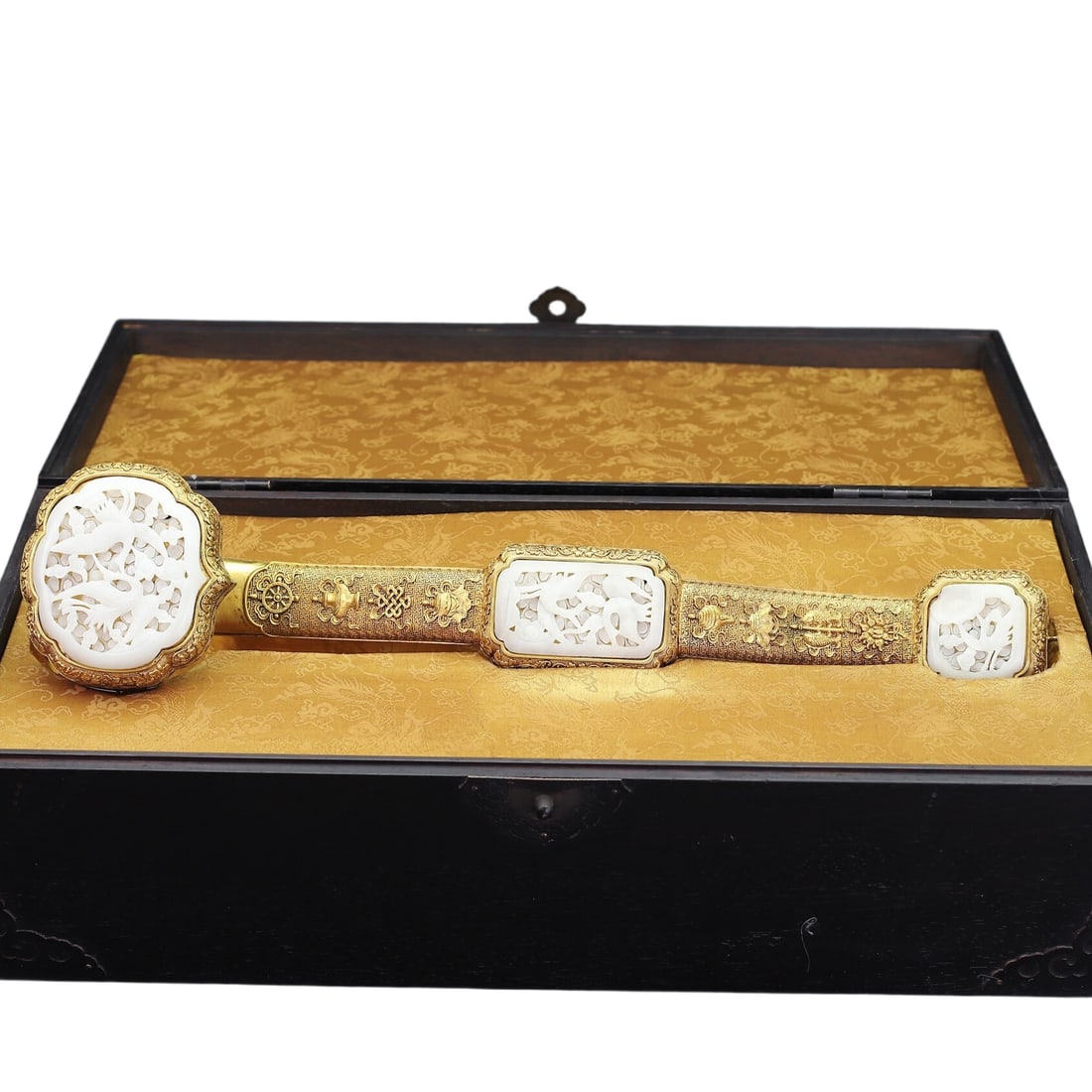 Gilt Bronze Hand-Carved Ruyi: A hand-carved copper gilt Ruyi ornament with Hetian jade inlay, featuring delicate and smooth jade with a lustrous texture. The ornament is 47 cm long, 10 cm wide, and weighs 1880 grams. It comes with