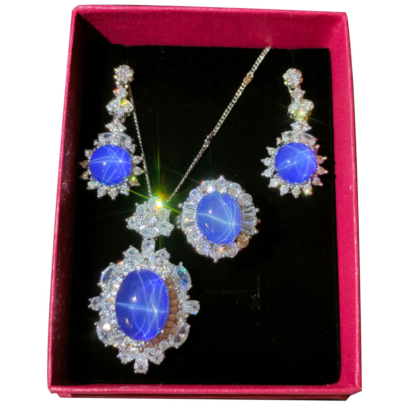 Silver Inlaid Star Gem Jewelry Set: Silver-set starlight gemstone jewelry set, crystal clear and dazzling. Hardness reaches ten, showcasing extraordinary quality and beauty.Ring face dimensions 1.6/1.2cm Freight: 1.International Freight